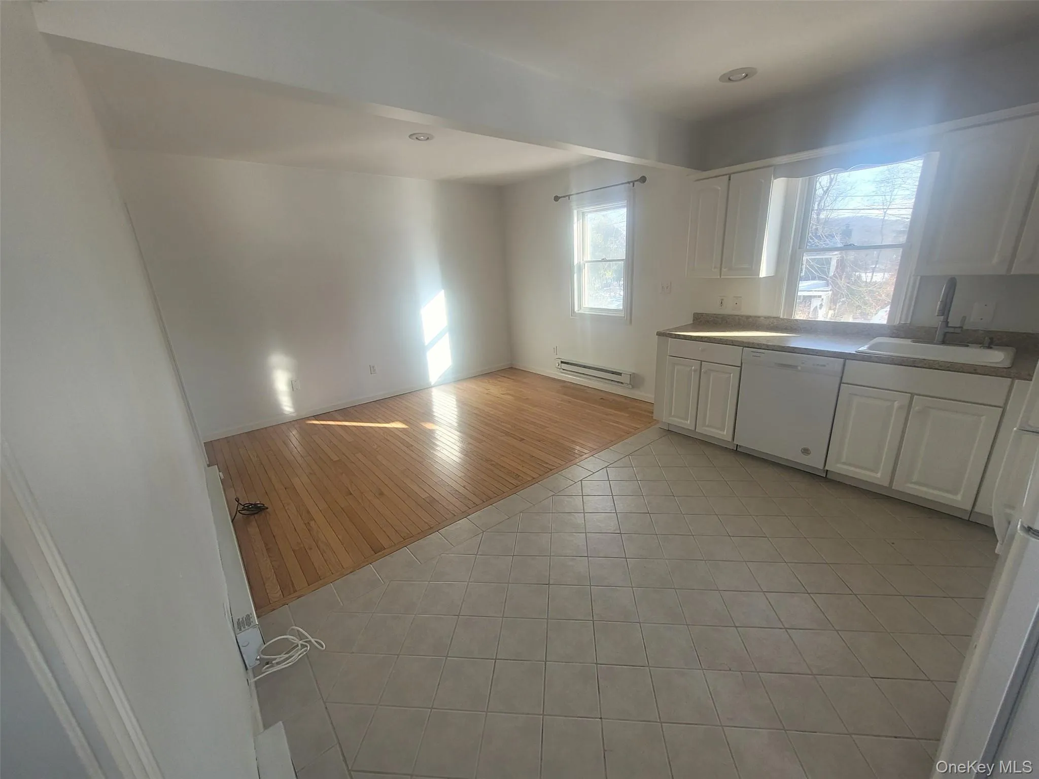 View of Kitchen and Living room with tile and hardwood floors View of Kitchen and Living room with tile and hardwood floors