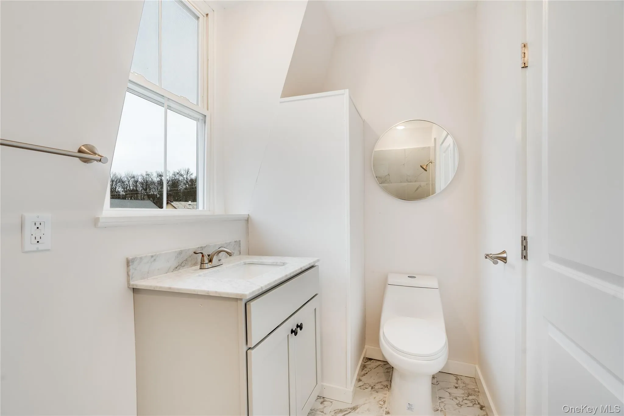 Bathroom featuring toilet and vanity Bathroom featuring toilet and vanity