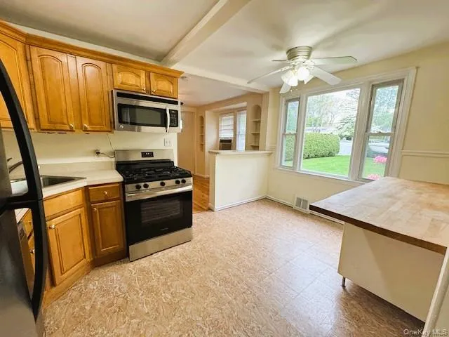 Kitchen featuring a Kitchen Nook with a large window overlooking the Entertaining Backyard and Patio. Kitchen featuring a Kitchen Nook with a large window overlooking the Entertaining Backyard and Patio.