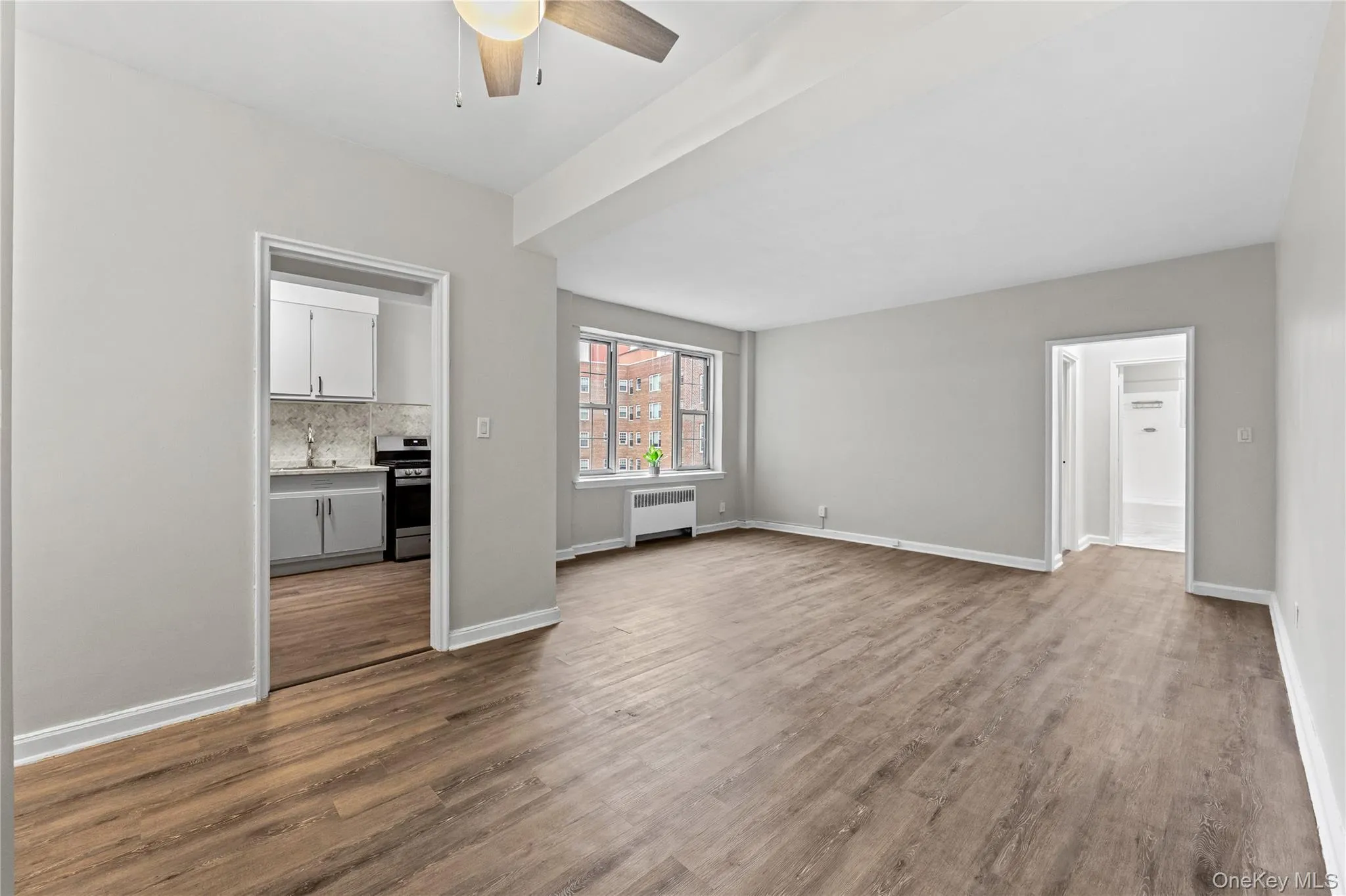 Unfurnished living room featuring ceiling fan Unfurnished living room featuring ceiling fan