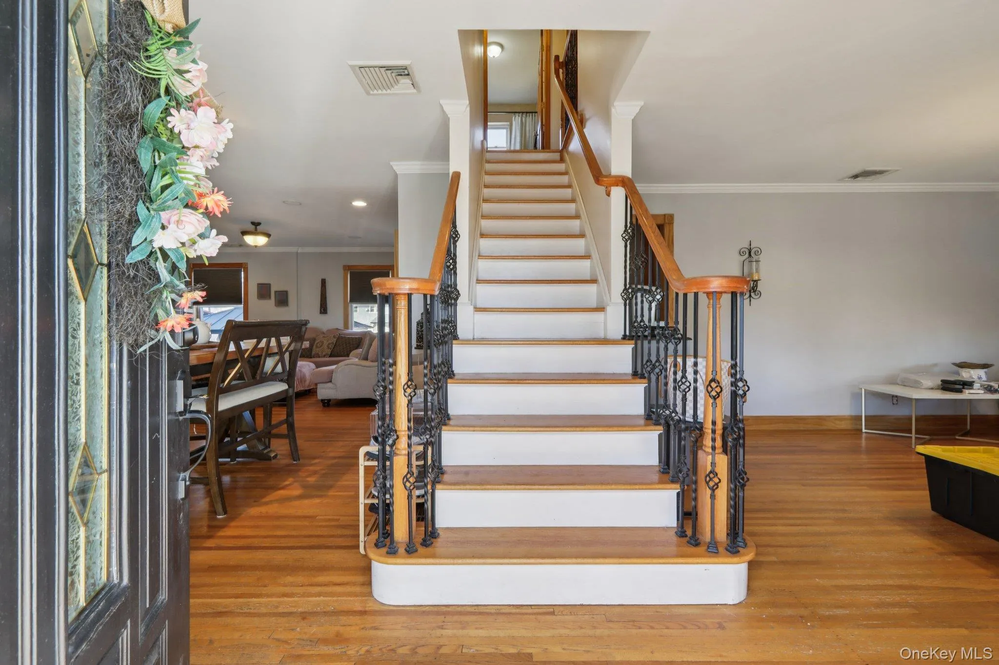Stairway with wood finished floors and ornamental molding Stairway with wood finished floors and ornamental molding