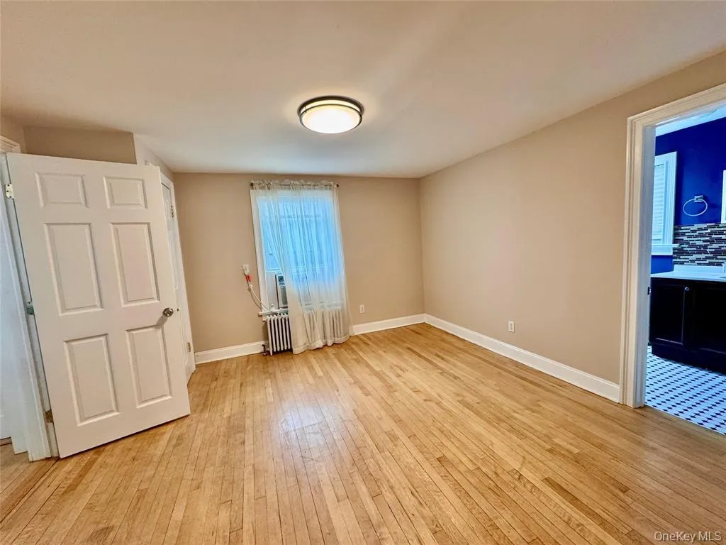 Dining area with kitchen to left, accessed from french doors in living room Dining area with kitchen to left, accessed from french doors in living room
