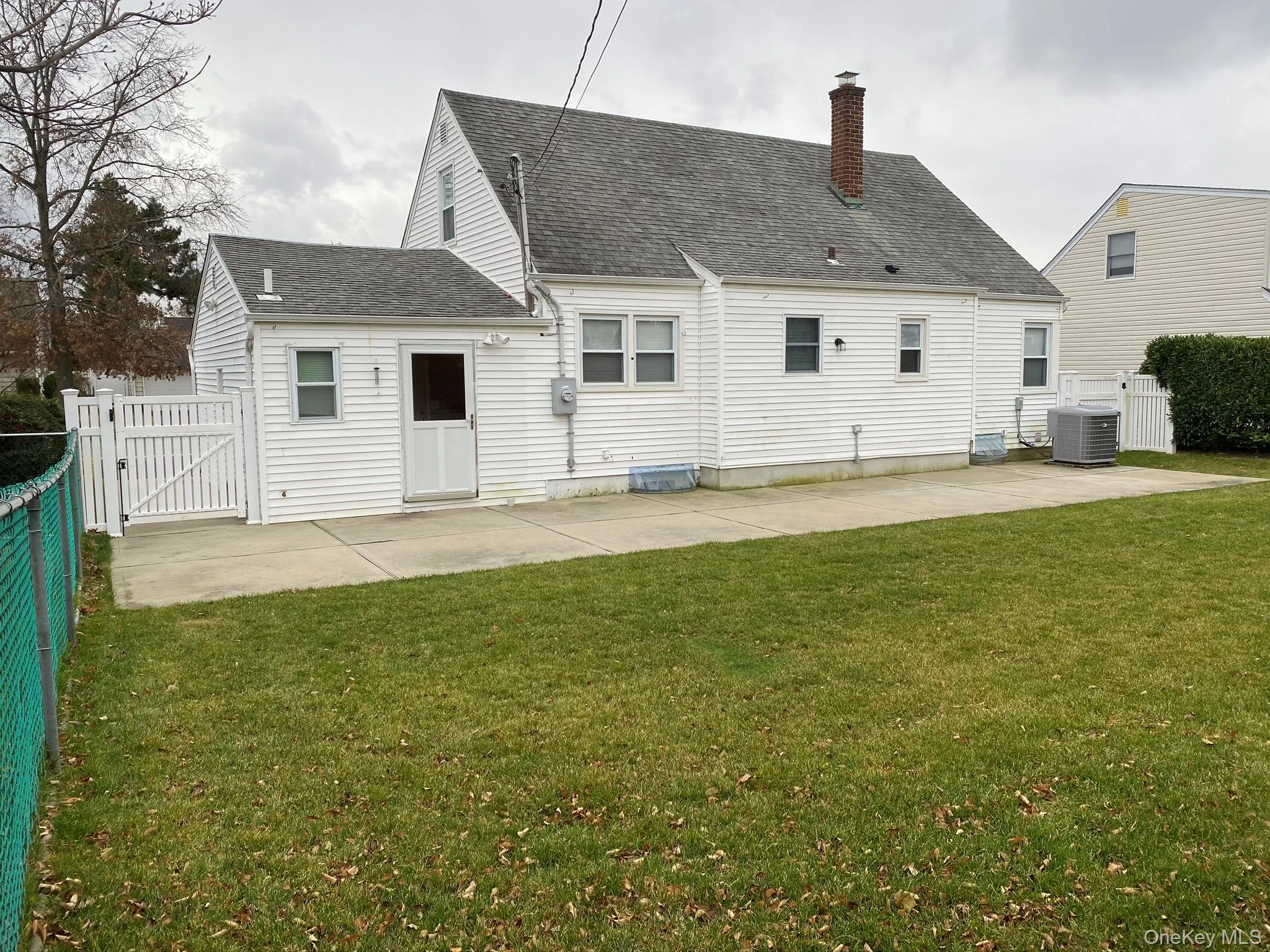 Rear view of property with a patio. Rear view of property with a patio.