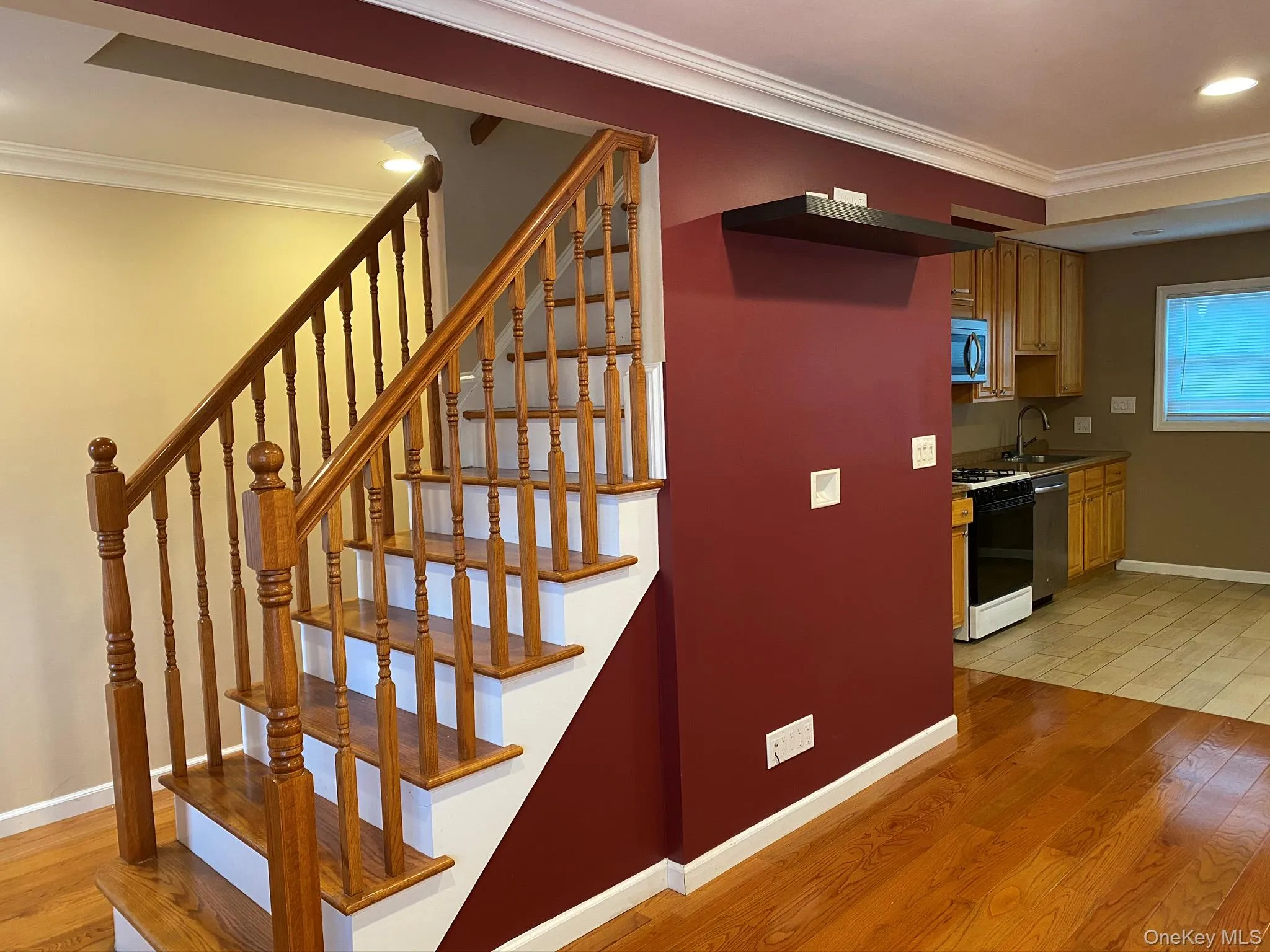 Stairs with crown molding, hardwood / wood-style flooring, and recessed lighting Stairs with crown molding, hardwood / wood-style flooring, and recessed lighting