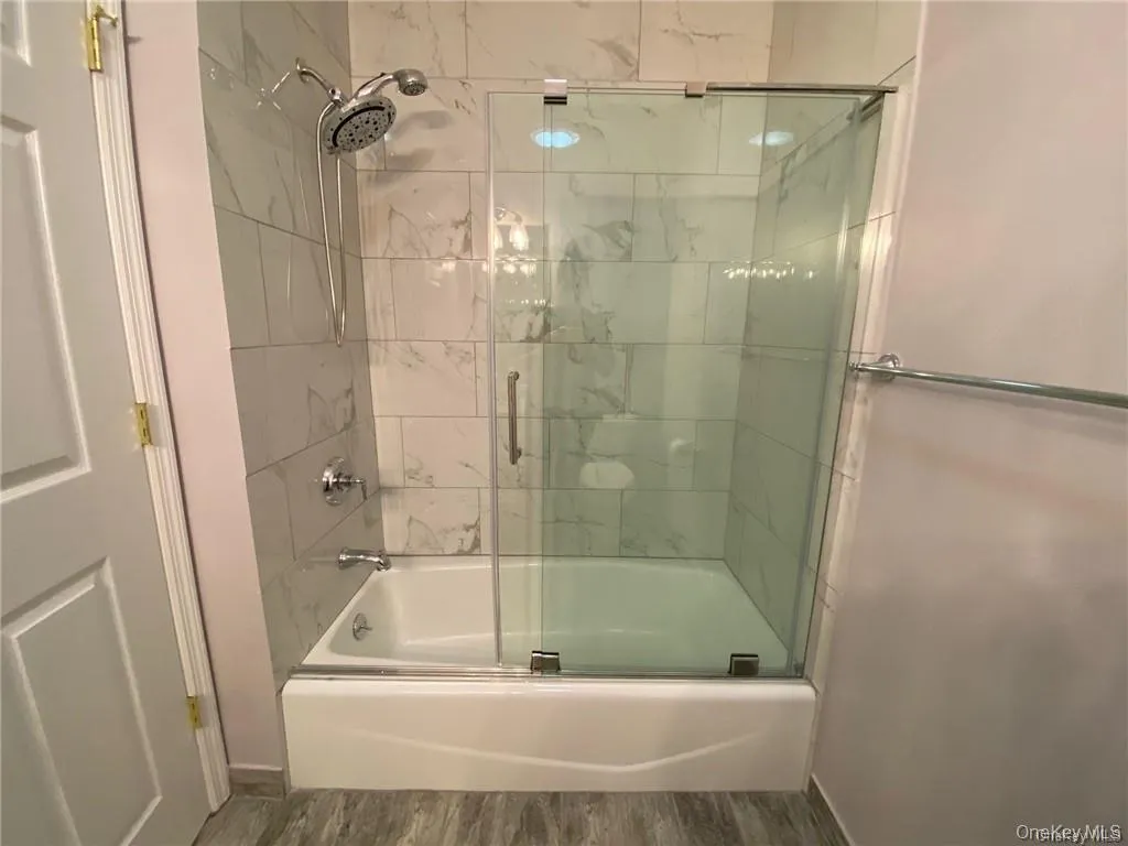 Additional full bathroom with tub and shower Additional full bathroom with tub and shower