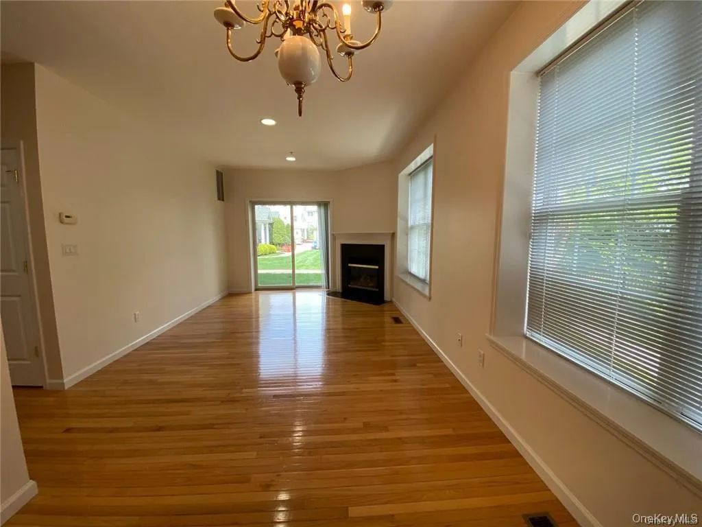 Beautiful living and dining area featuring gleaming hardwood floors Beautiful living and dining area featuring gleaming hardwood floors