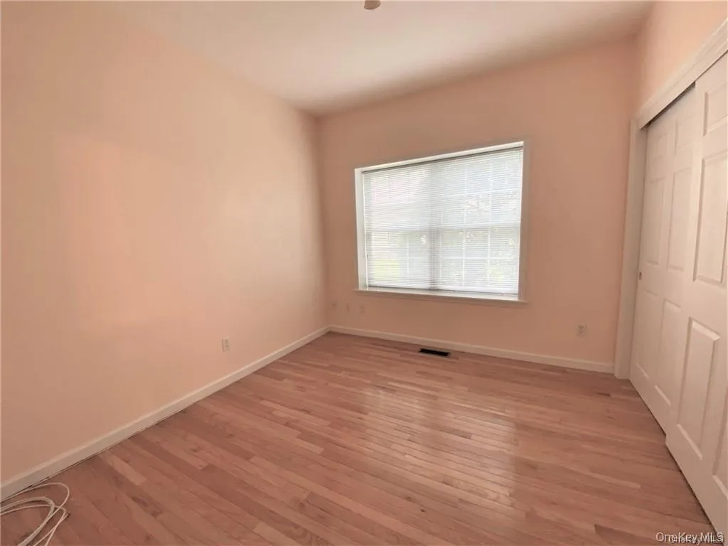 Bright and comfortable bedroom with abundant closet storage Bright and comfortable bedroom with abundant closet storage