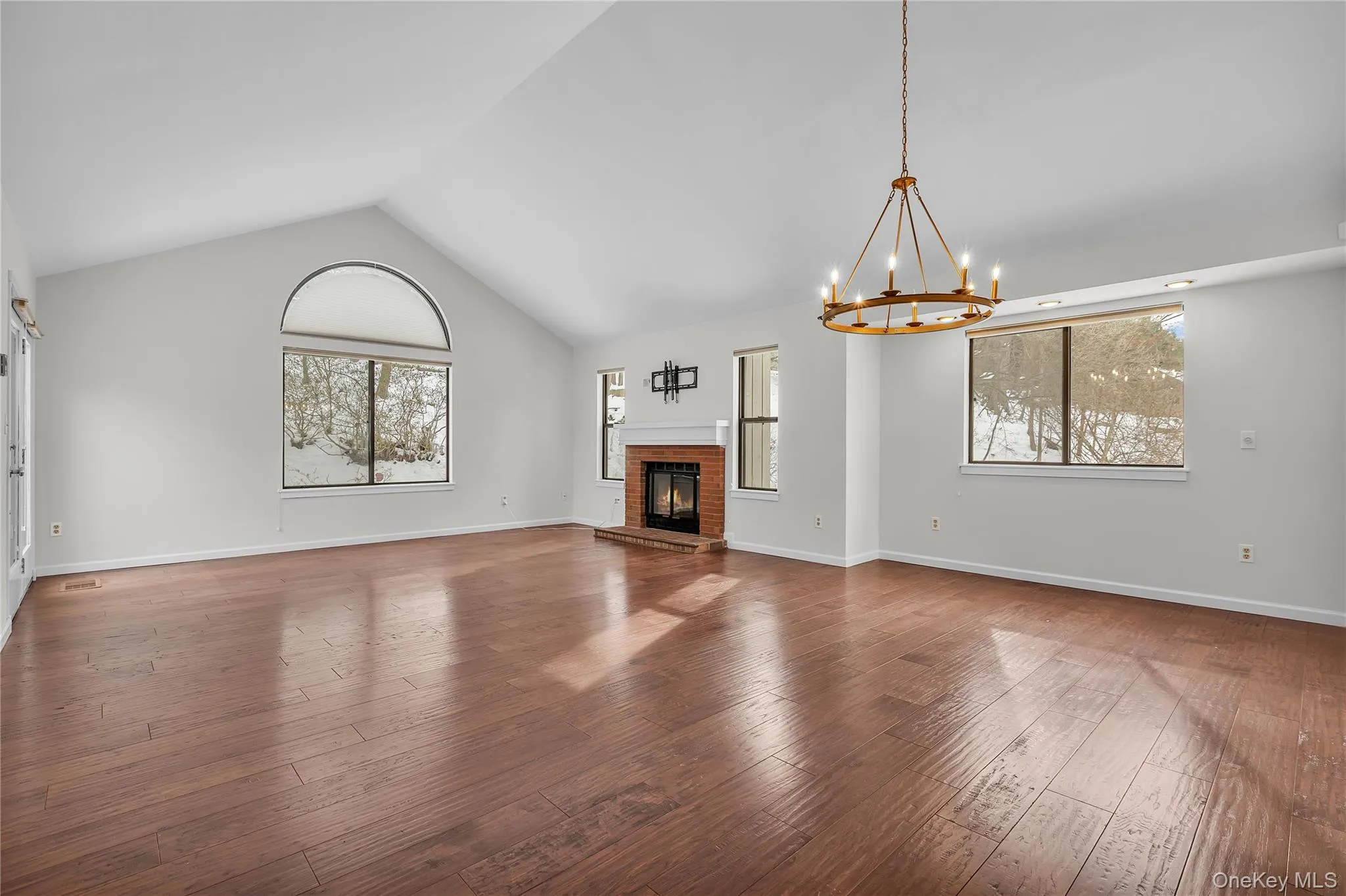 Beautiful Living Room with fireplace, vaulted ceilings, lots of light and door to slate patio. Beautiful Living Room with fireplace, vaulted ceilings, lots of light and door to slate patio.