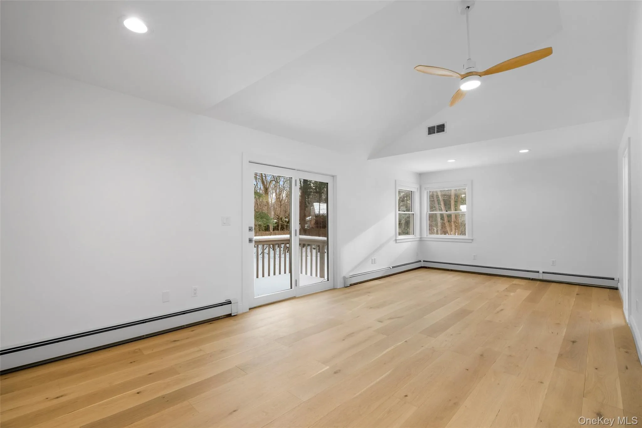 The primary bedroom also offers a deck overlooking the serene backyard. The primary bedroom also offers a deck overlooking the serene backyard.