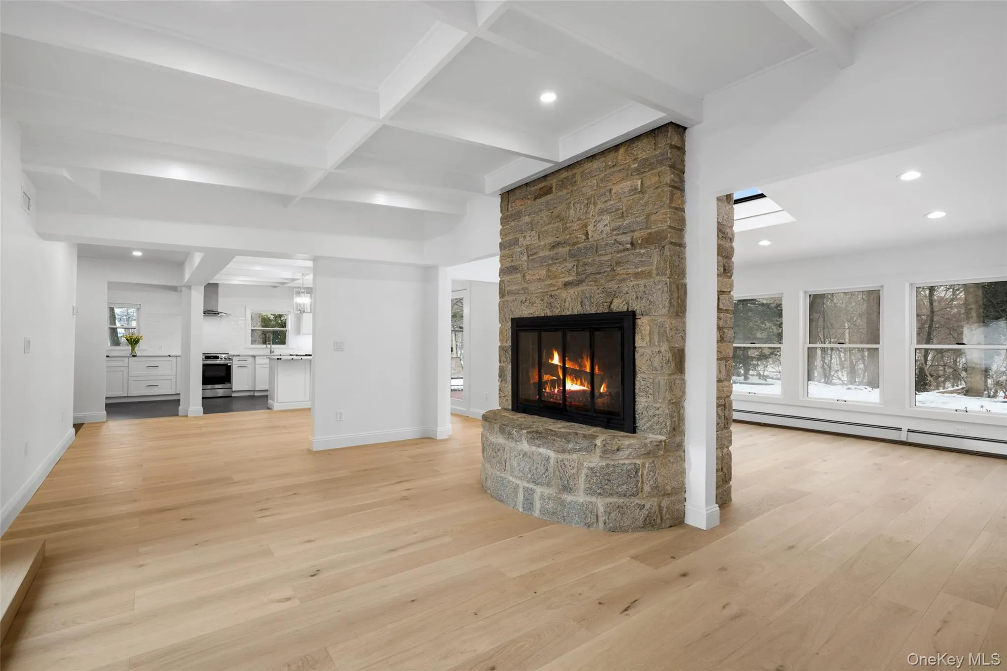 The open concept design connects the kitchen to the dining and living areas. The open concept design connects the kitchen to the dining and living areas.