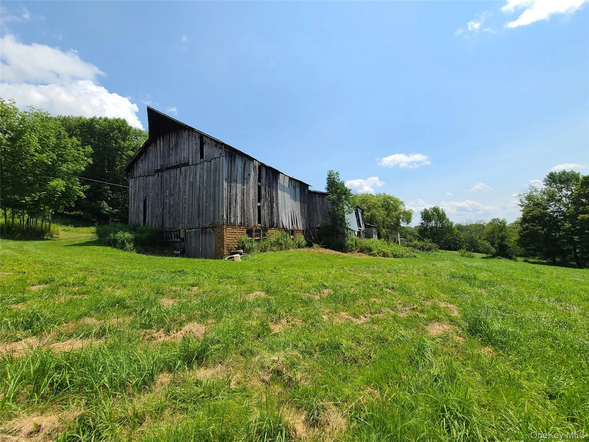 View of grassy field featuring a barn View of grassy field featuring a barn