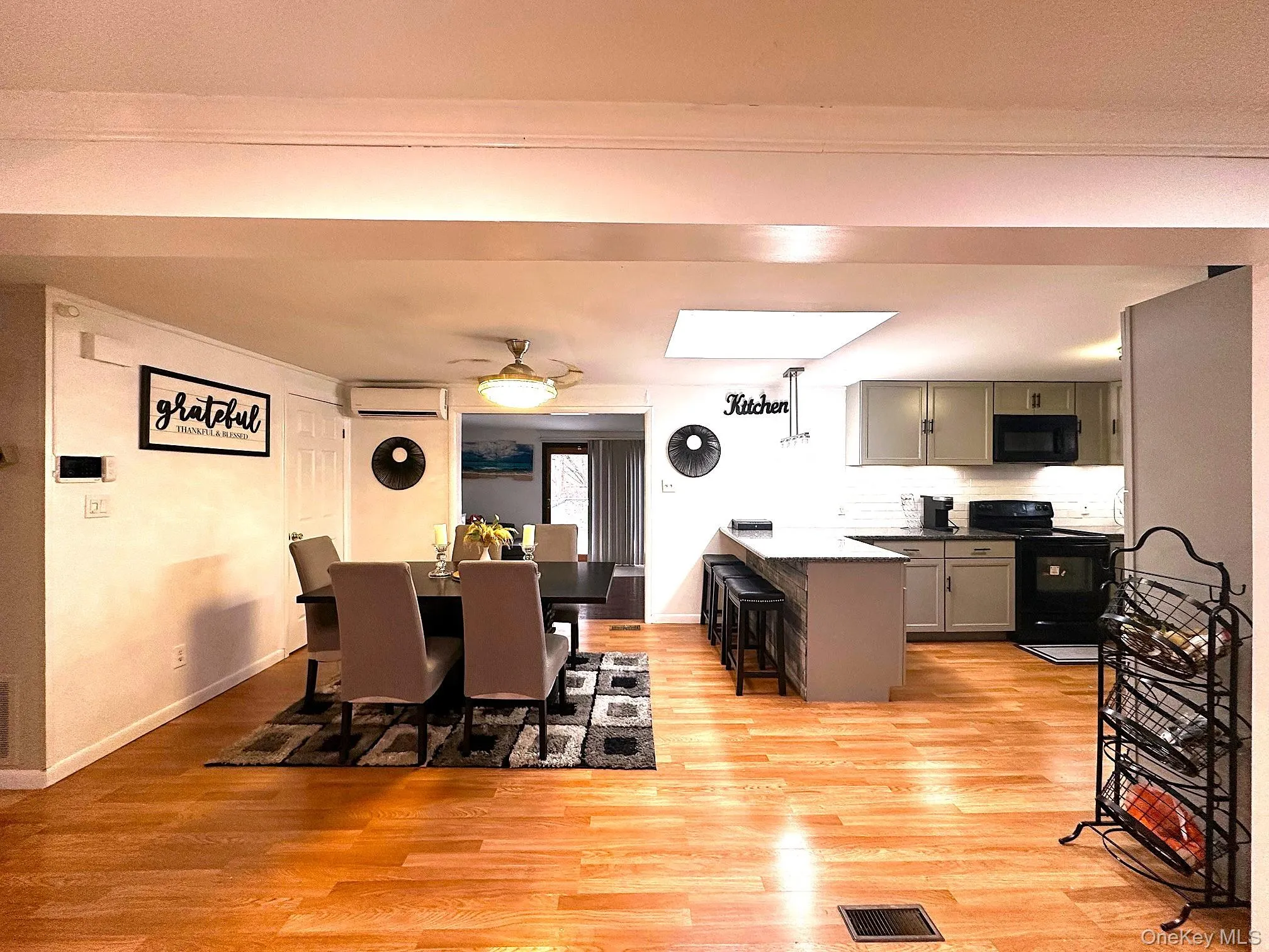 beautifully updated Kitchen and Dining room area. Granite counters, subway tile backsplash, updated appliance new cabinets. Mini split beautifully updated Kitchen and Dining room area. Granite counters, subway tile backsplash, updated appliance new cabinets. Mini split