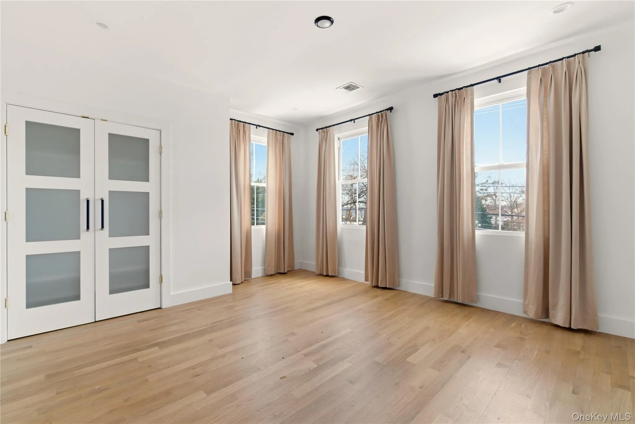 Spacious Bedroom with white oak floors Spacious Bedroom with white oak floors