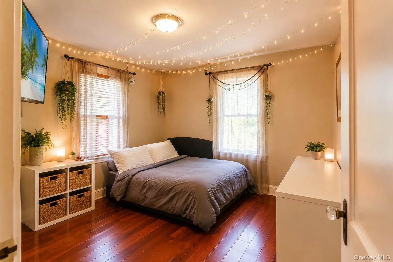 Room with rich Brazilian cherry wood flooring, two windows with blinds Room with rich Brazilian cherry wood flooring, two windows with blinds