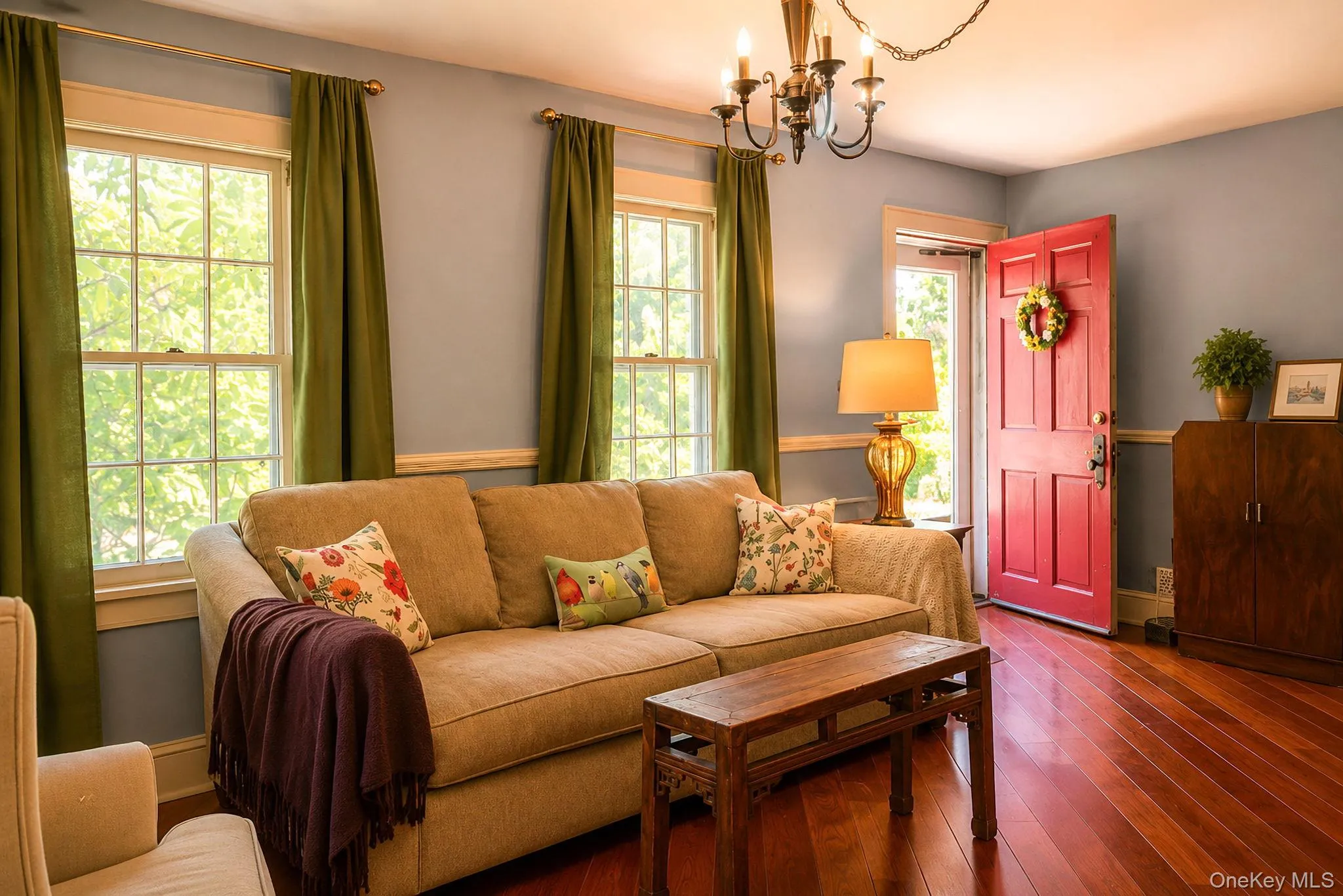Bright living space featuring warm Brazilian cherry wood flooring Bright living space featuring warm Brazilian cherry wood flooring