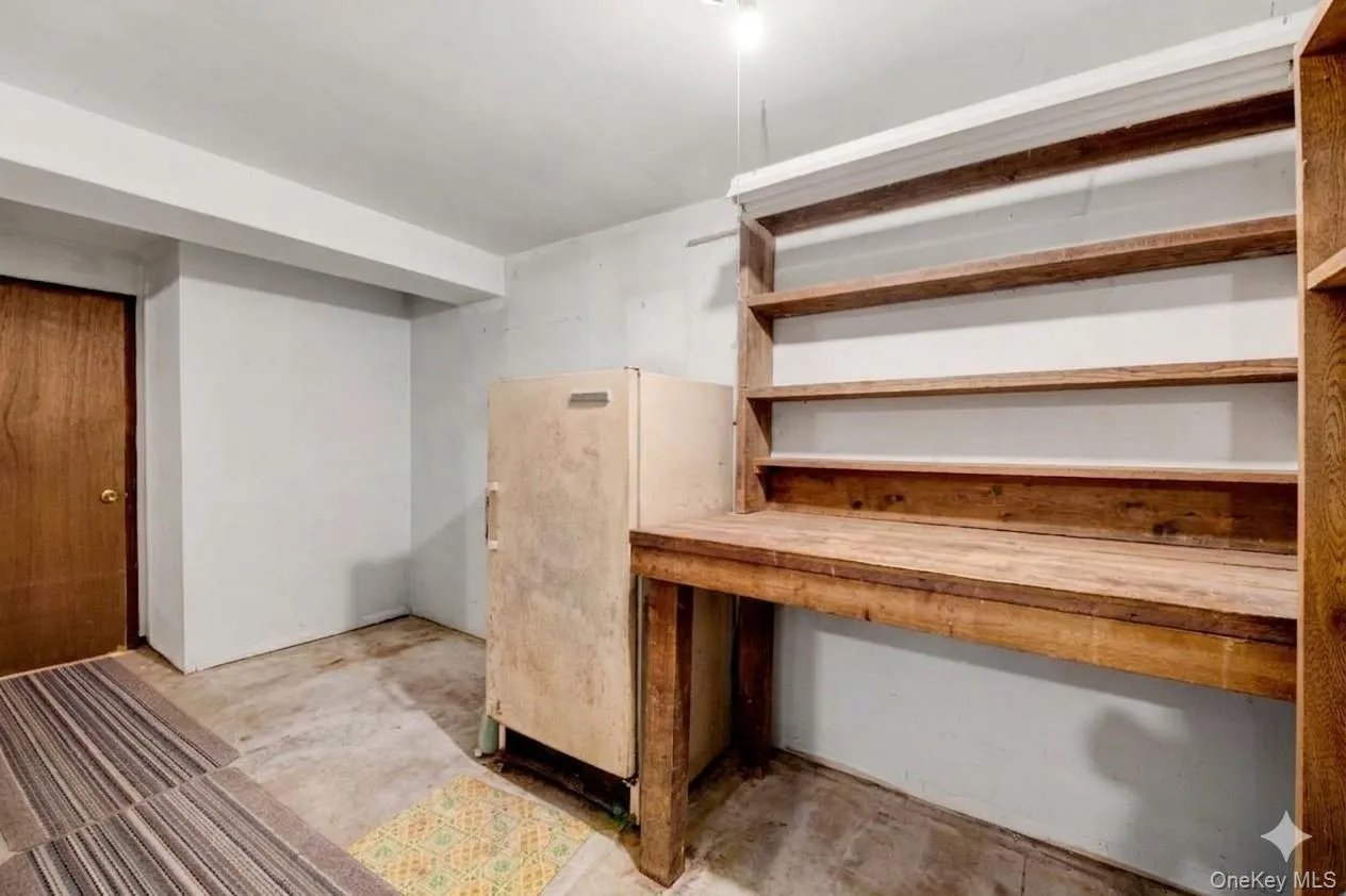 Finished basement featuring freestanding refrigerator Finished basement featuring freestanding refrigerator