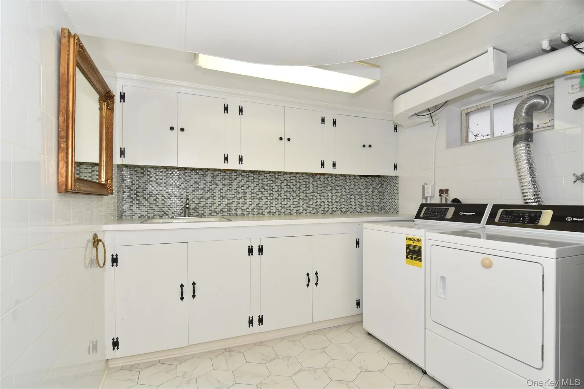 Laundrey room featuring wonderful storage. Washer/dryer included. Laundrey room featuring wonderful storage. Washer/dryer included.