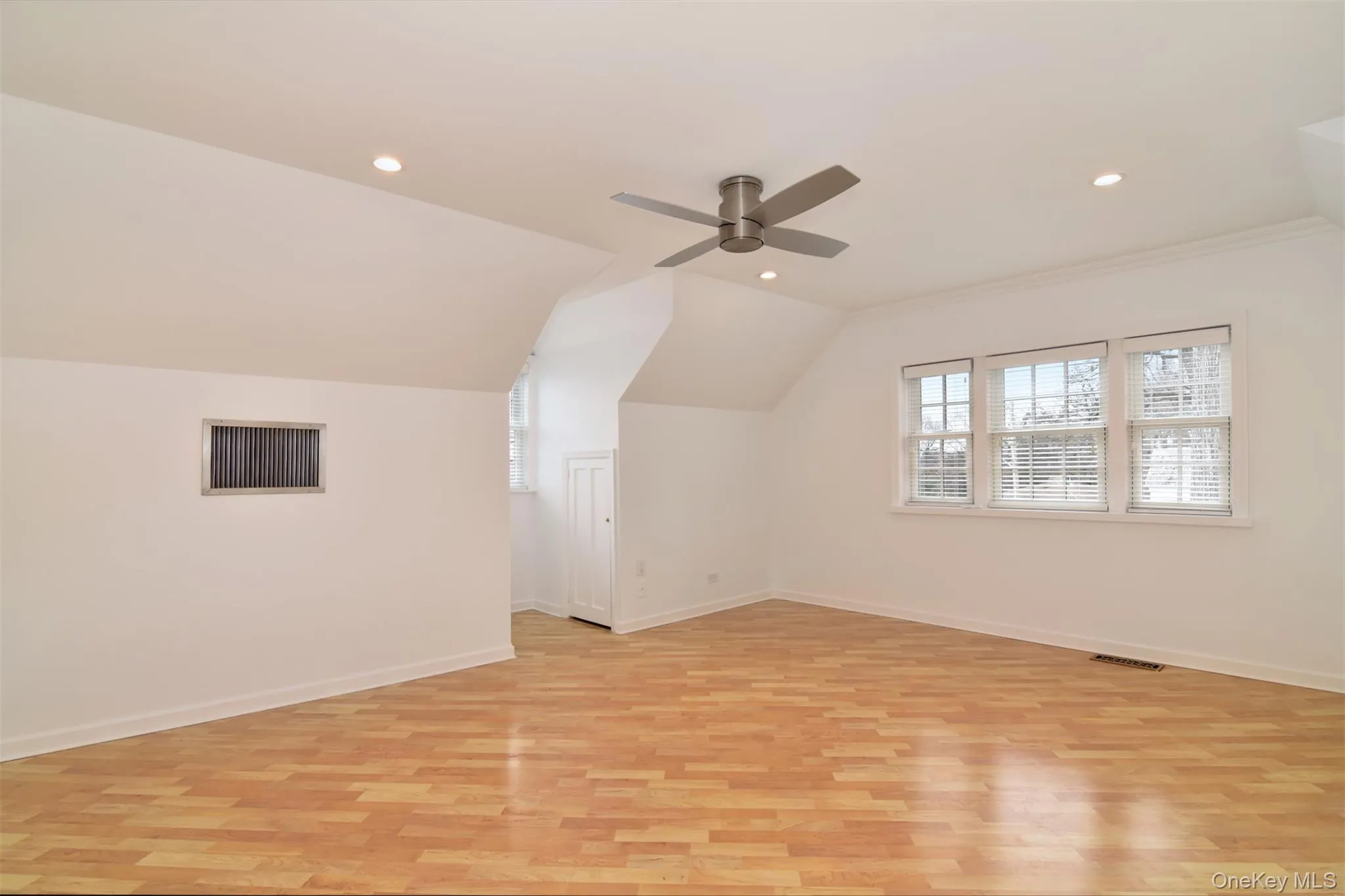Second bedroom with light wood-style flooring, recessed lighting, lofted ceiling, and a ceiling fan Second bedroom with light wood-style flooring, recessed lighting, lofted ceiling, and a ceiling fan
