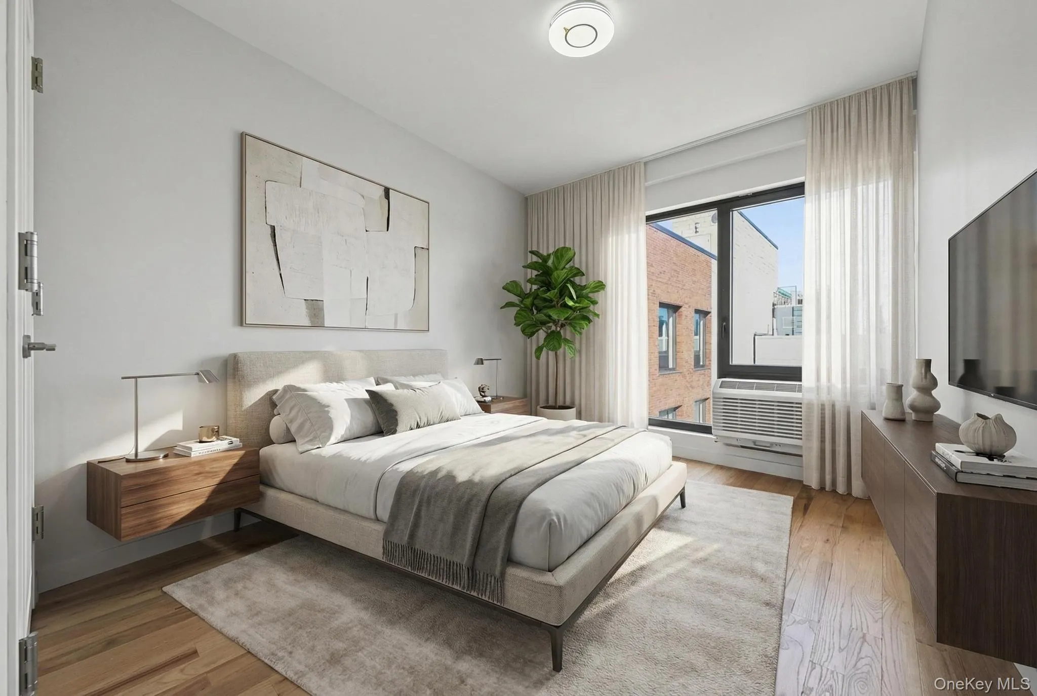 Bedroom featuring light wood-style flooring Bedroom featuring light wood-style flooring