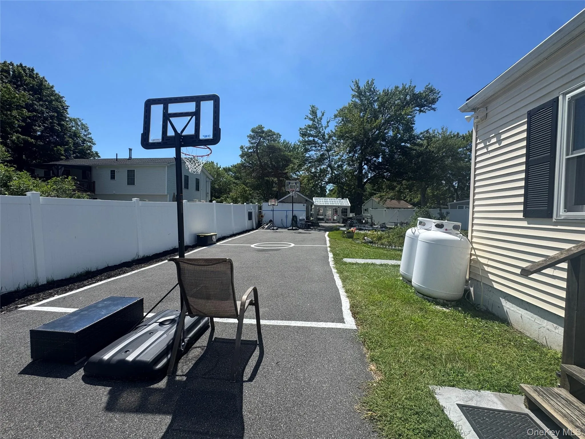 basketball court with 3 hoops and painted boundaries basketball court with 3 hoops and painted boundaries