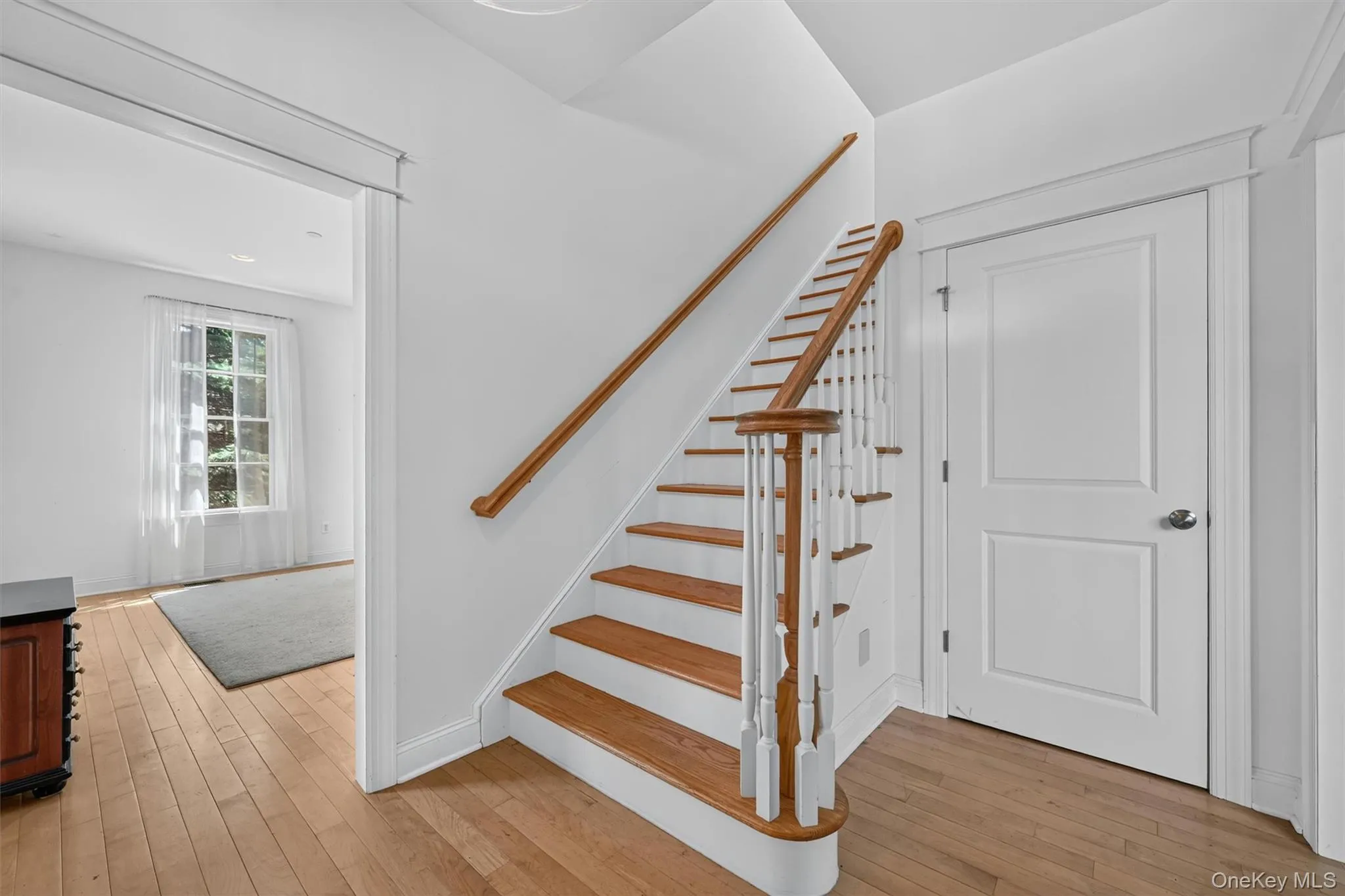 The bright foyer opens to hardwood floors, tall ceilings, and a graceful staircase leading to the second level. The bright foyer opens to hardwood floors, tall ceilings, and a graceful staircase leading to the second level.