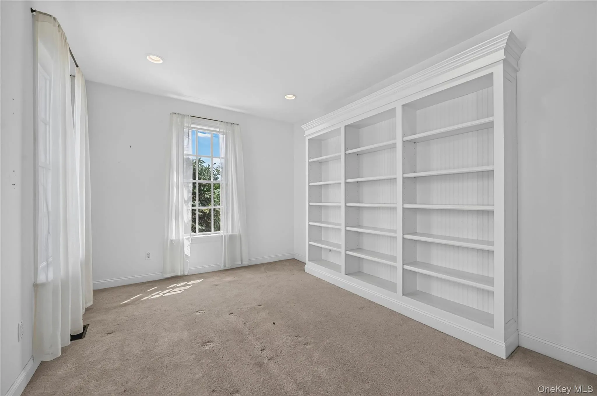 Built-in bookshelves add charm and function to this bright second-level flex space. Built-in bookshelves add charm and function to this bright second-level flex space.