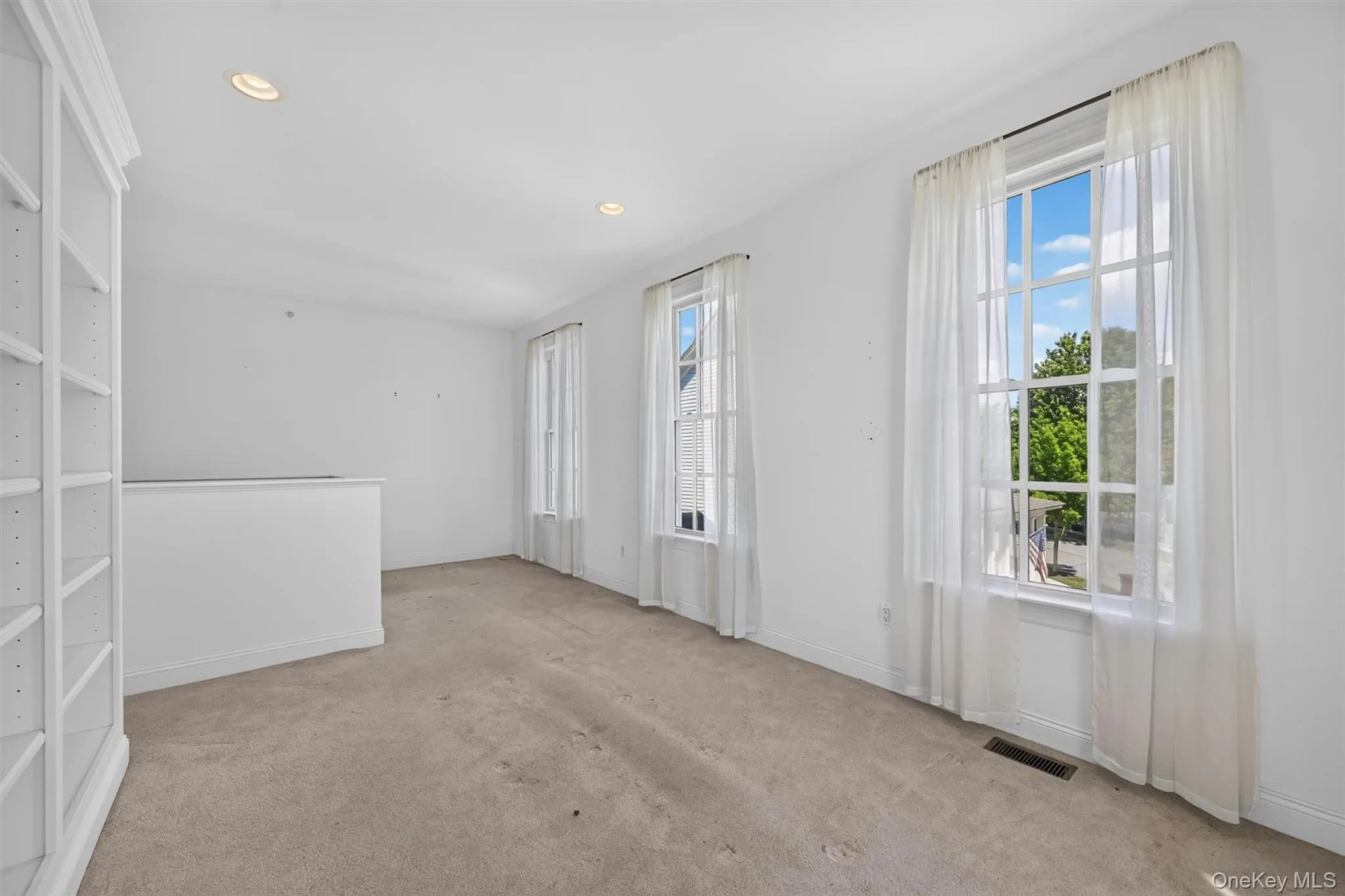 Large windows fill the upstairs bonus area with light, creating a peaceful spot to read, work, or unwind. Large windows fill the upstairs bonus area with light, creating a peaceful spot to read, work, or unwind.