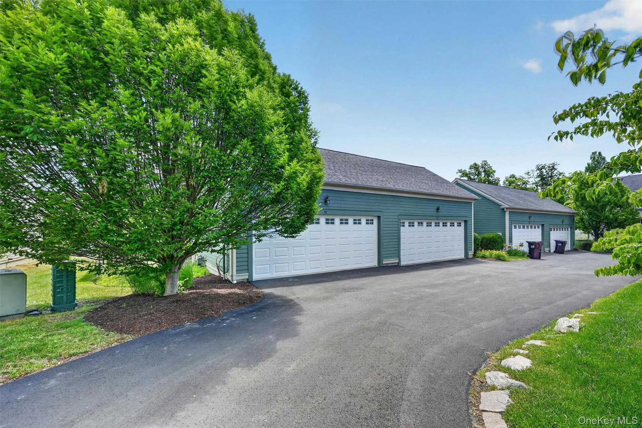 The spacious two-car garage includes lofted storage, offering plenty of room for vehicles, outdoor supplies, seasonal items, and more. The spacious two-car garage includes lofted storage, offering plenty of room for vehicles, outdoor supplies, seasonal items, and more.