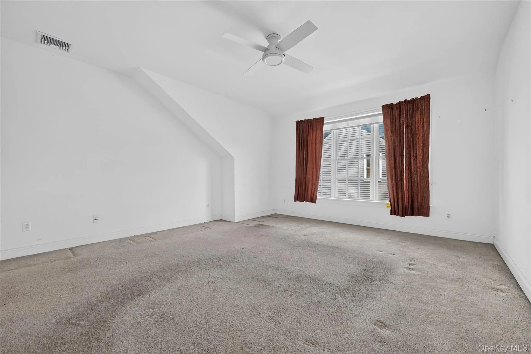The second upstairs bedroom offers generous space and great potential, ready to be refreshed with new carpeting and your favorite paint color. The second upstairs bedroom offers generous space and great potential, ready to be refreshed with new carpeting and your favorite paint color.