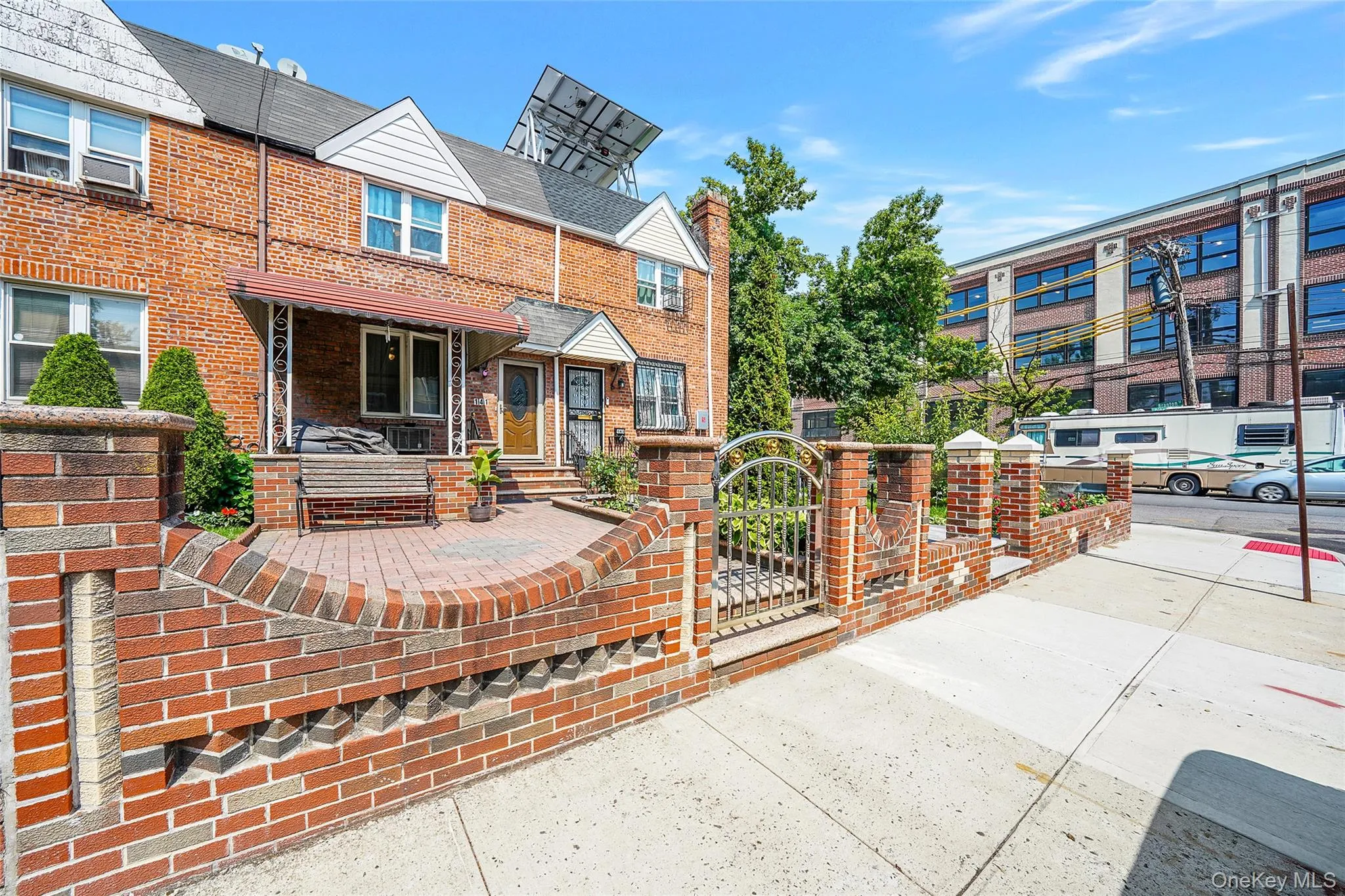 Townhome / multi-family property with brick siding Townhome / multi-family property with brick siding