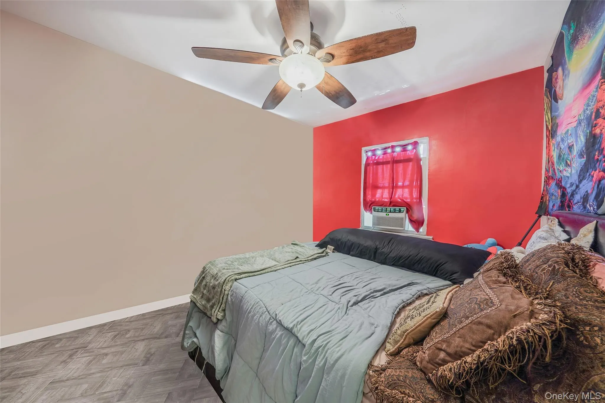 Bedroom with a ceiling fan and cooling unit Bedroom with a ceiling fan and cooling unit