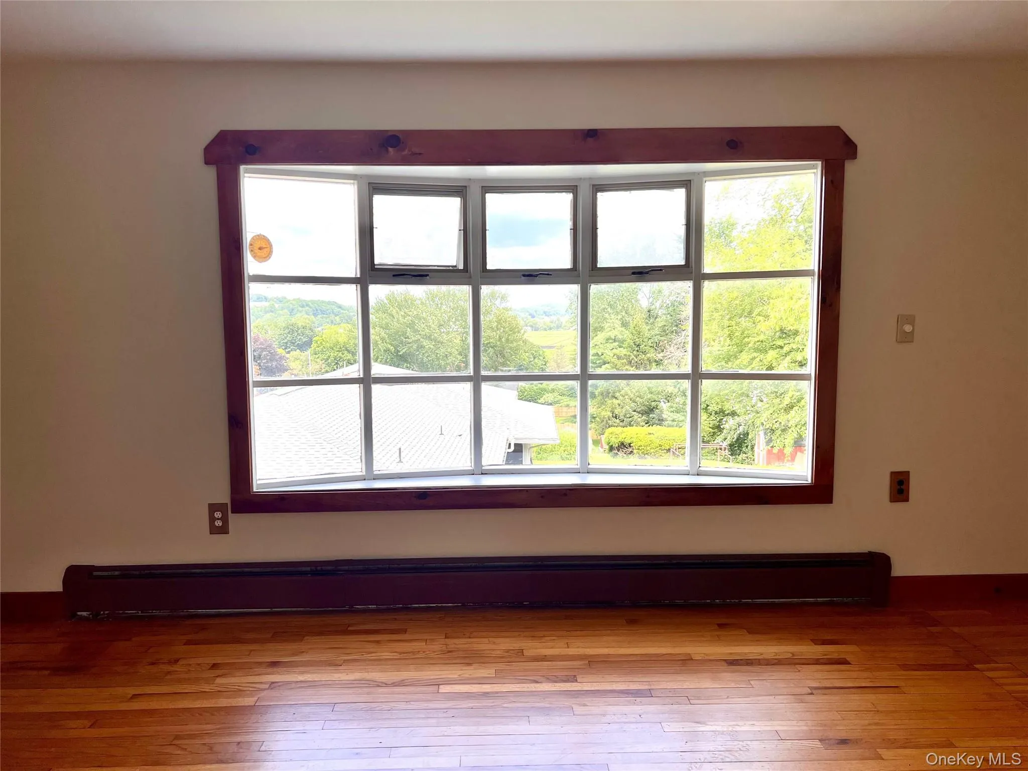 Large living room window w/ farm views Large living room window w/ farm views