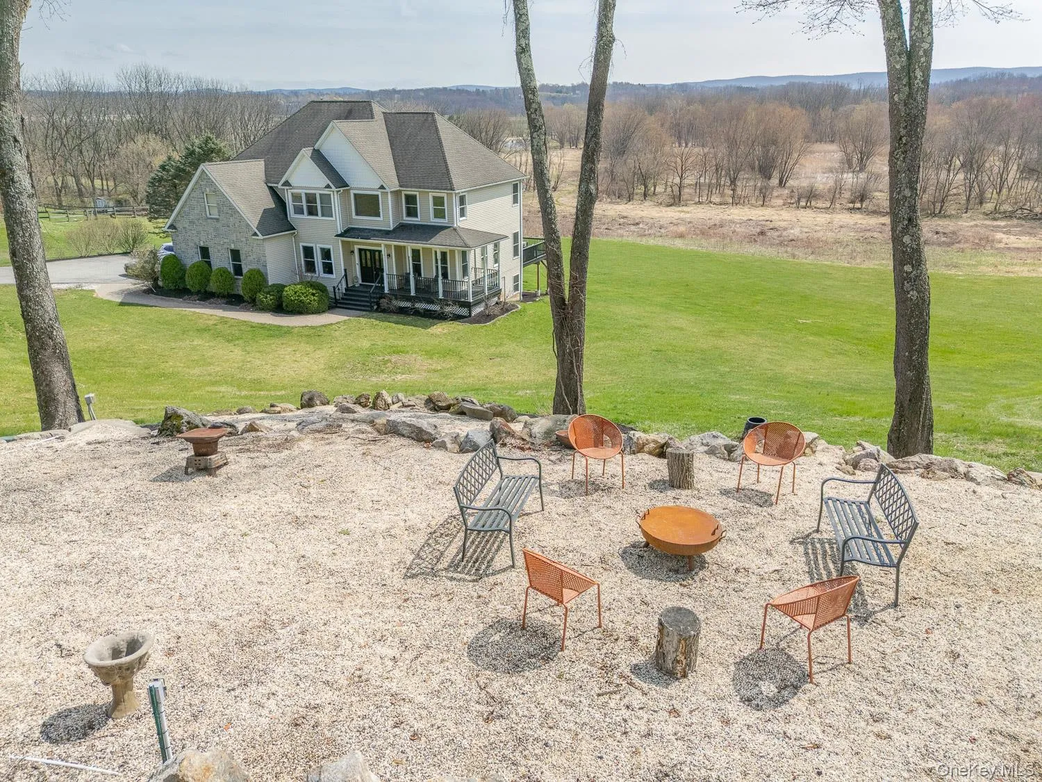 Thoughtfully designed stone seating area in the front yard, complete with power access—perfect for gatherings, evenings by the fire, or outdoor entertaining. Thoughtfully designed stone seating area in the front yard, complete with power access—perfect for gatherings, evenings by the fire, or outdoor entertaining.