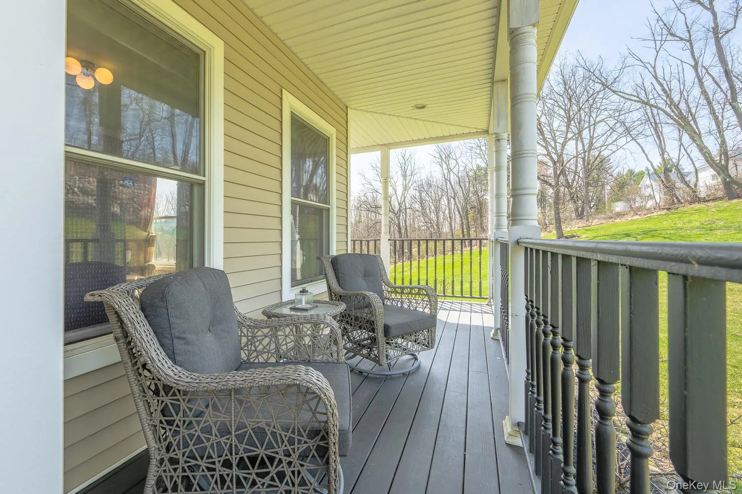 Charming covered front porch, perfect for morning coffee or relaxing evenings. Charming covered front porch, perfect for morning coffee or relaxing evenings.