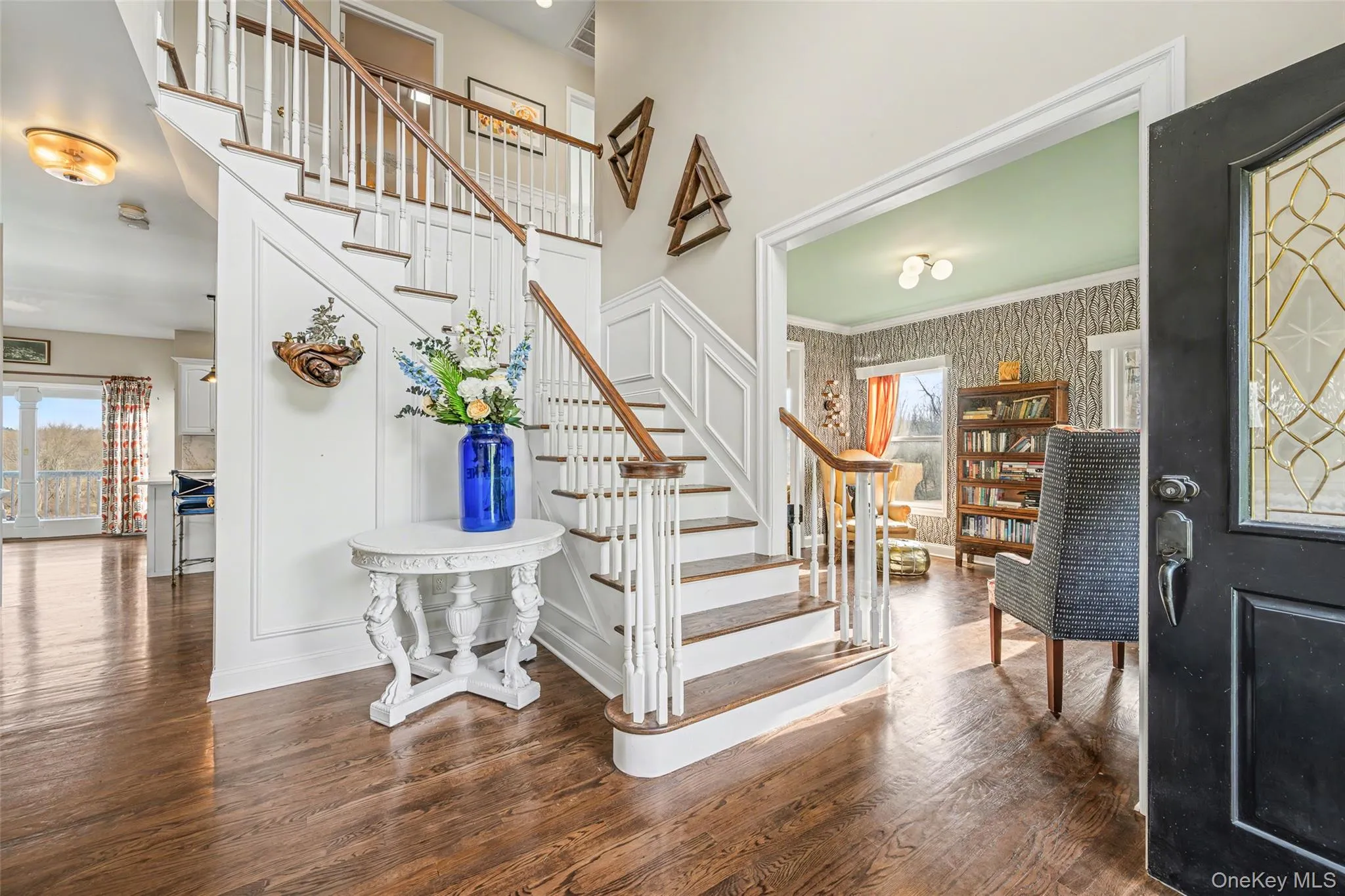 Light-filled entry with open sightlines to the main living spaces, offering an inviting flow and a seamless transition throughout the home. Light-filled entry with open sightlines to the main living spaces, offering an inviting flow and a seamless transition throughout the home.