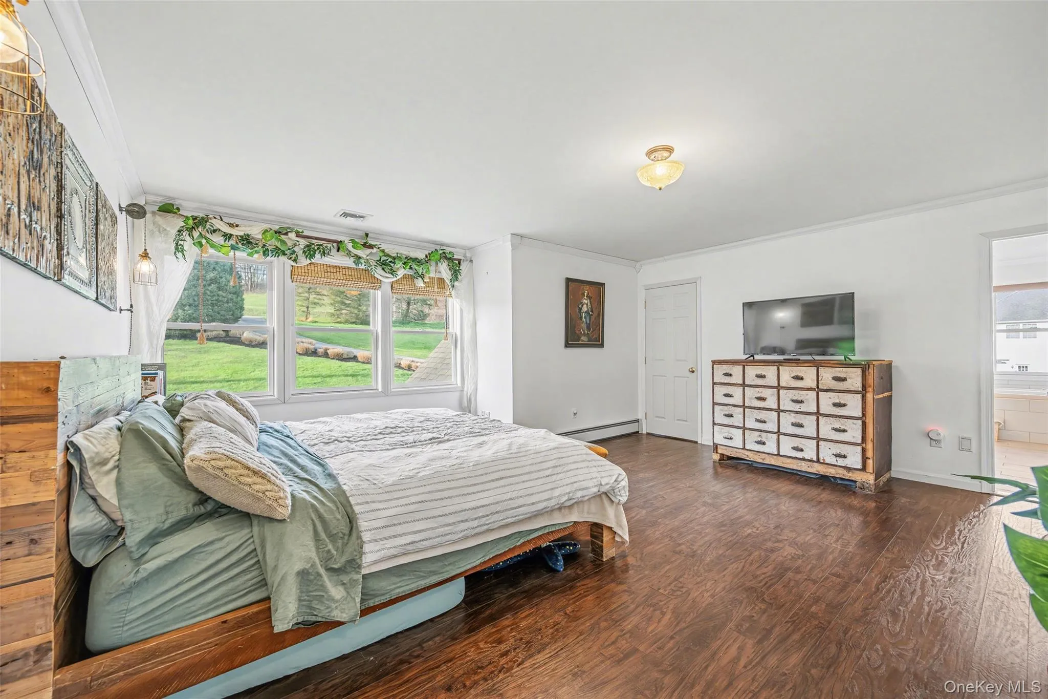 Bright and airy primary bedroom with expansive layout and serene views, creating a comfortable and private escape. Bright and airy primary bedroom with expansive layout and serene views, creating a comfortable and private escape.