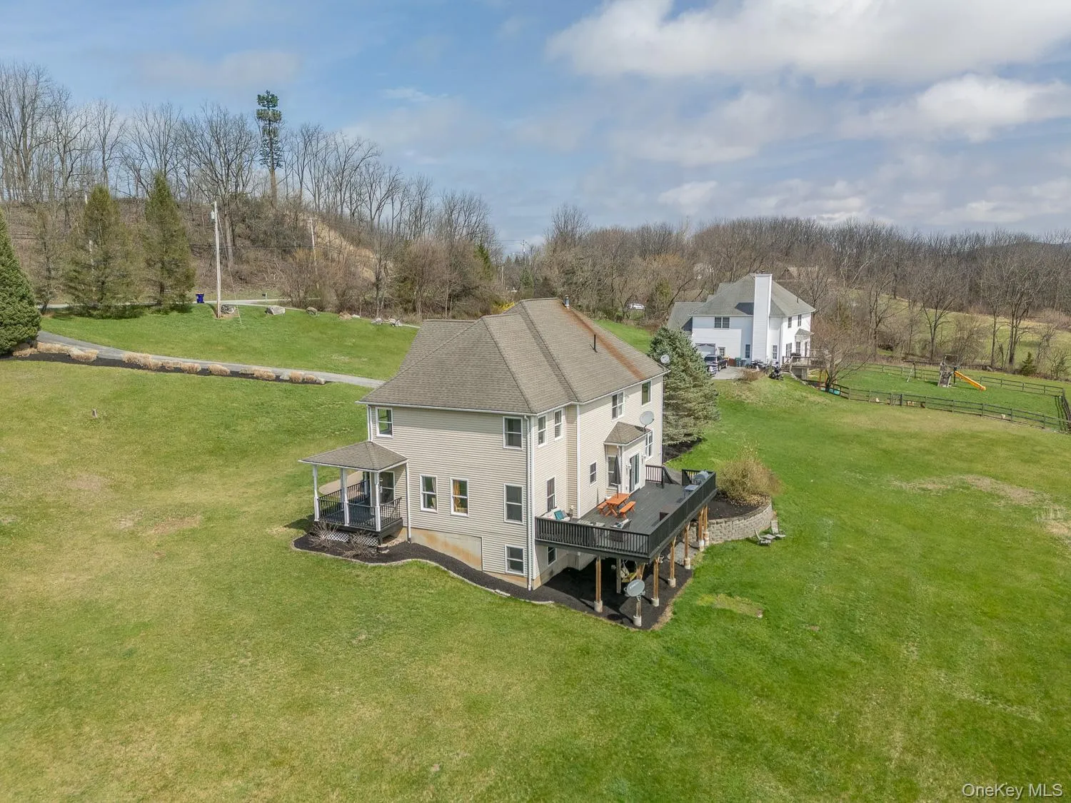 Expansive rear deck overlooks the property, offering the perfect setting for outdoor dining and gatherings. Expansive rear deck overlooks the property, offering the perfect setting for outdoor dining and gatherings.