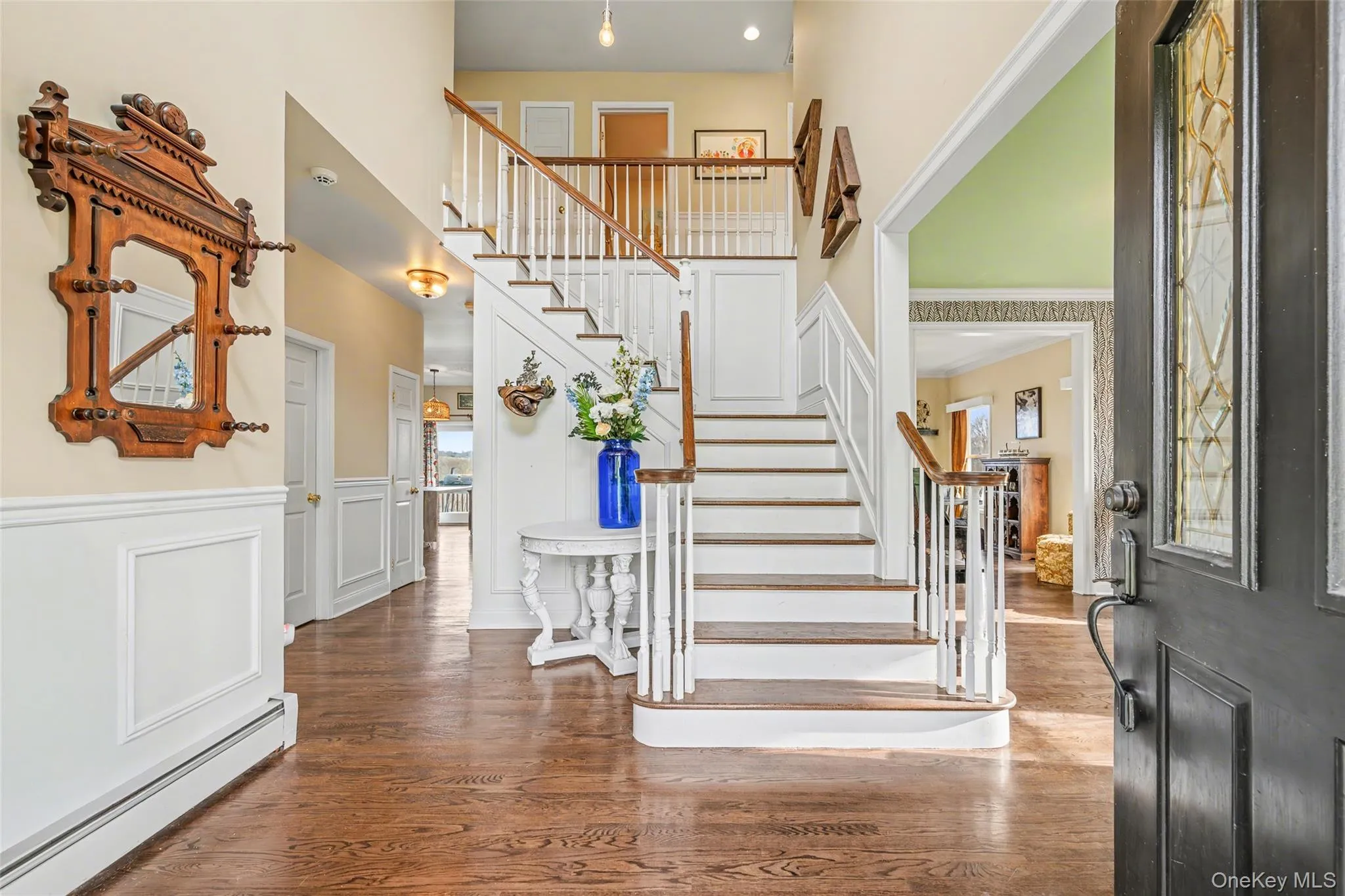 Welcoming two-story foyer with classic millwork, hardwood floors, and a graceful staircase that sets the tone for the home’s refined yet comfortable style. Welcoming two-story foyer with classic millwork, hardwood floors, and a graceful staircase that sets the tone for the home’s refined yet comfortable style.