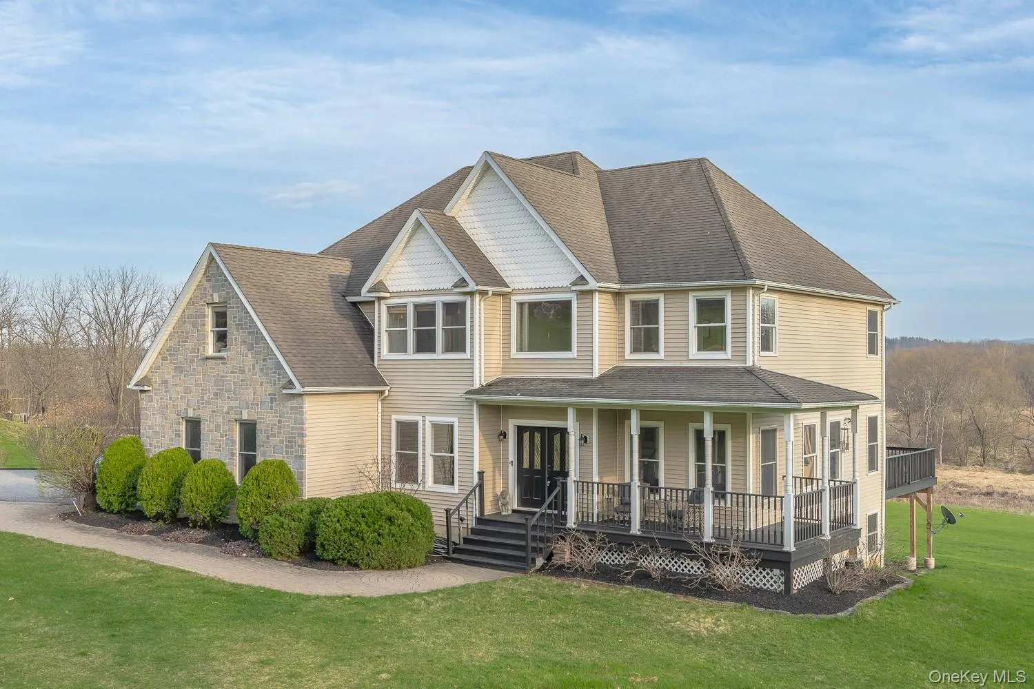 Beautifully maintained home with a timeless exterior, combining stone and siding for classic curb appeal, complemented by a welcoming front porch and scenic surroundings. Beautifully maintained home with a timeless exterior, combining stone and siding for classic curb appeal, complemented by a welcoming front porch and scenic surroundings.