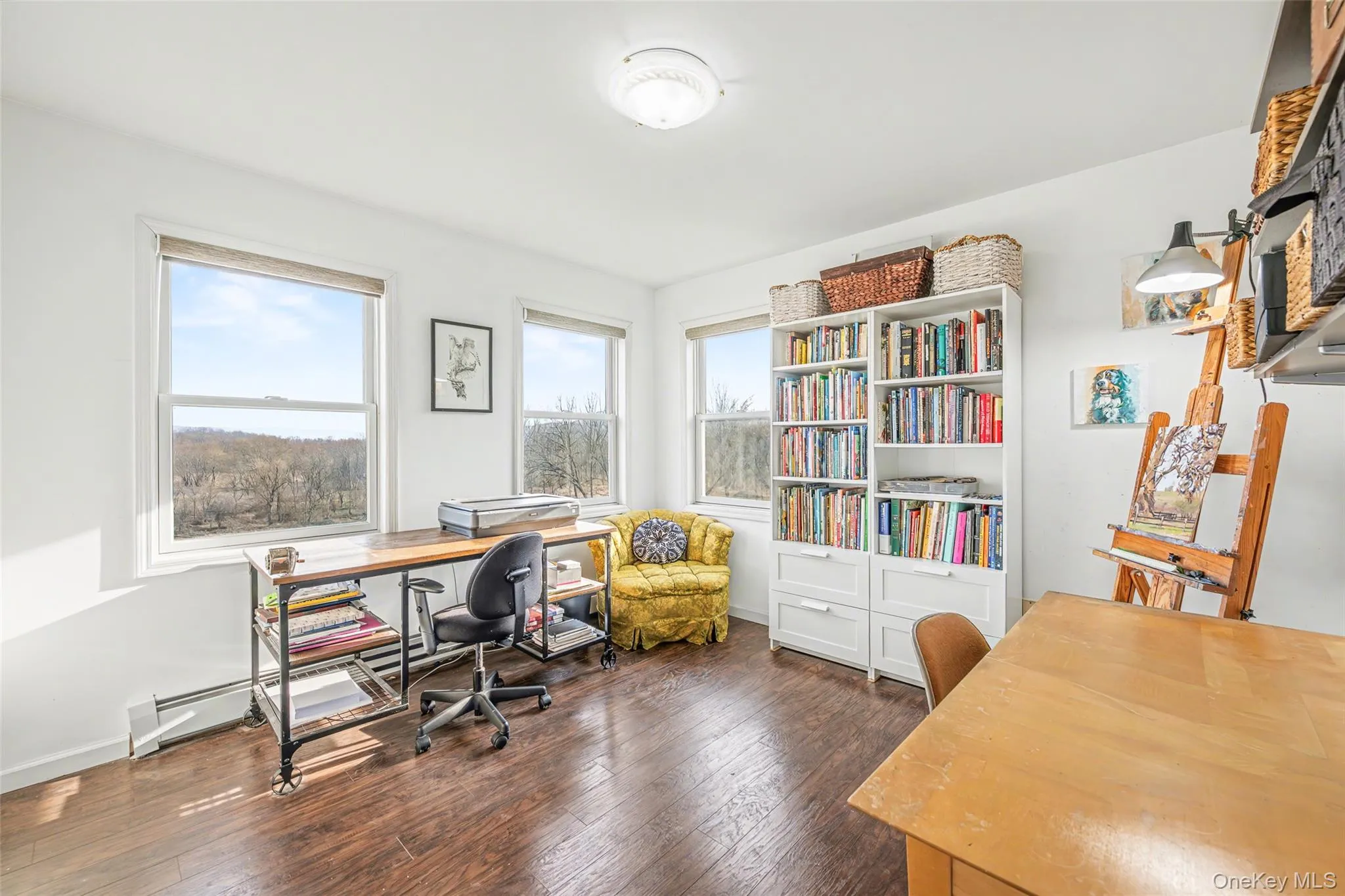 Bright corner room with multiple windows and scenic views, offering an ideal space for a home office, studio, or additional bedroom. Bright corner room with multiple windows and scenic views, offering an ideal space for a home office, studio, or additional bedroom.