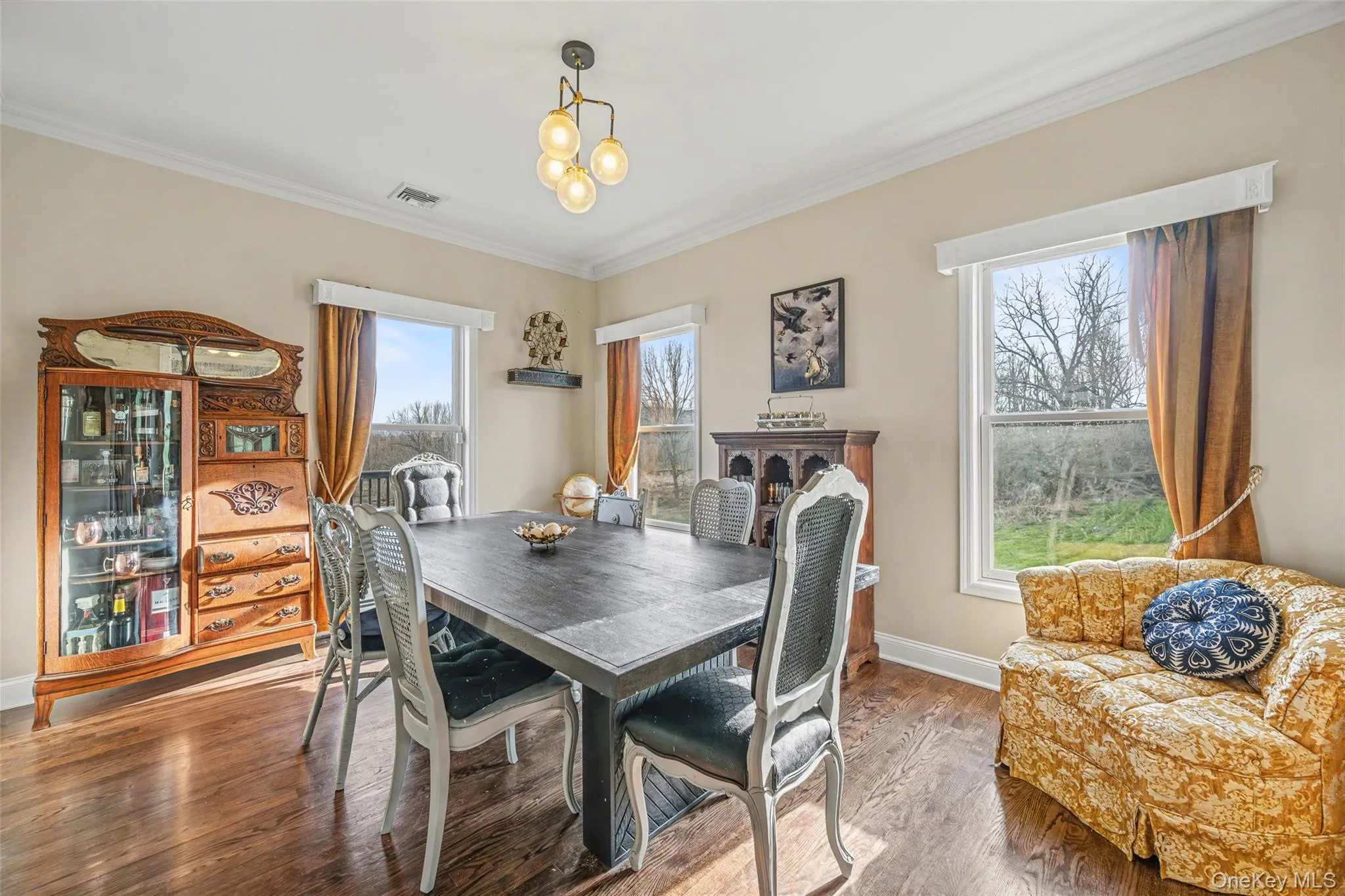 Formal dining area with generous proportions and natural light, providing an elegant setting for gatherings and special occasions. Formal dining area with generous proportions and natural light, providing an elegant setting for gatherings and special occasions.