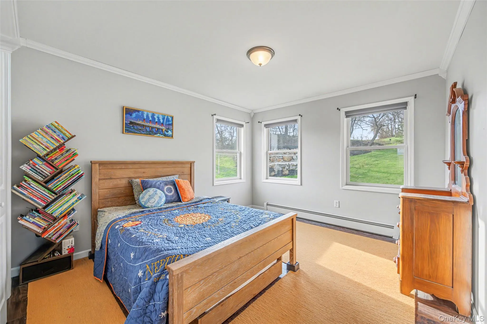 Well-proportioned bedroom with multiple windows and peaceful views, creating a calm and airy atmosphere. Well-proportioned bedroom with multiple windows and peaceful views, creating a calm and airy atmosphere.