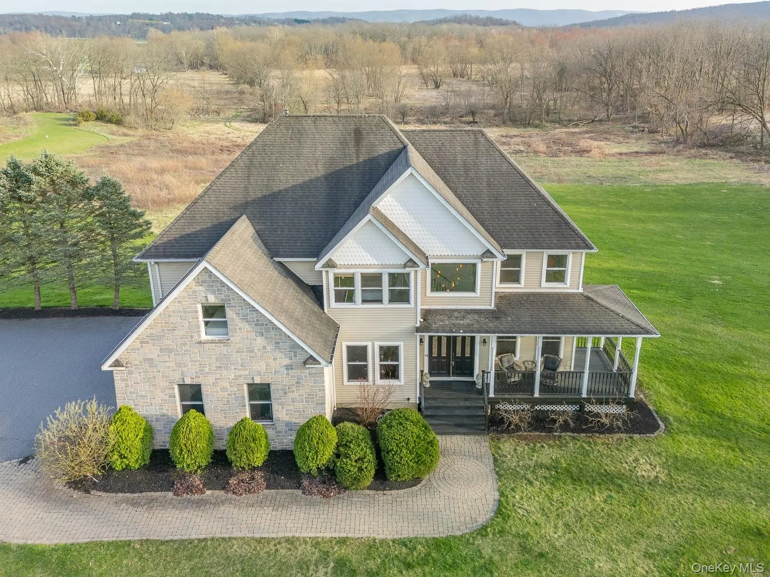 Welcoming front porch and manicured landscaping create a warm and inviting first impression. Welcoming front porch and manicured landscaping create a warm and inviting first impression.