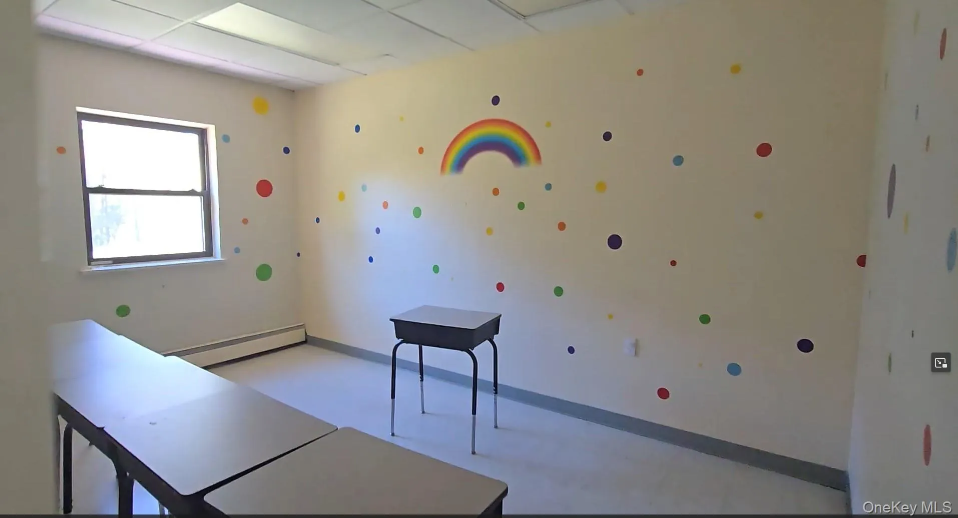 Office featuring a baseboard heating unit and a paneled ceiling Office featuring a baseboard heating unit and a paneled ceiling