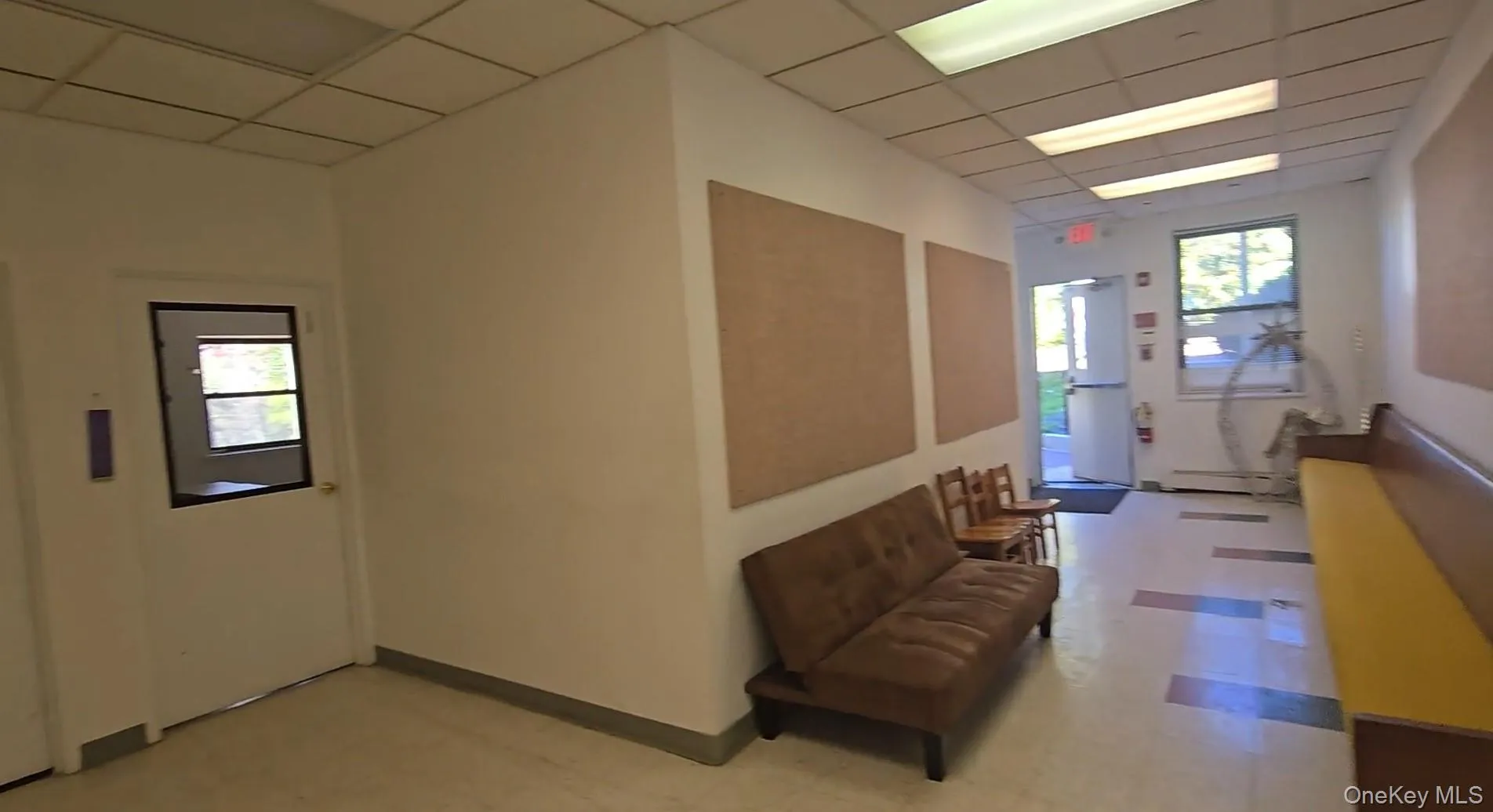 Community lobby featuring a drop ceiling Community lobby featuring a drop ceiling