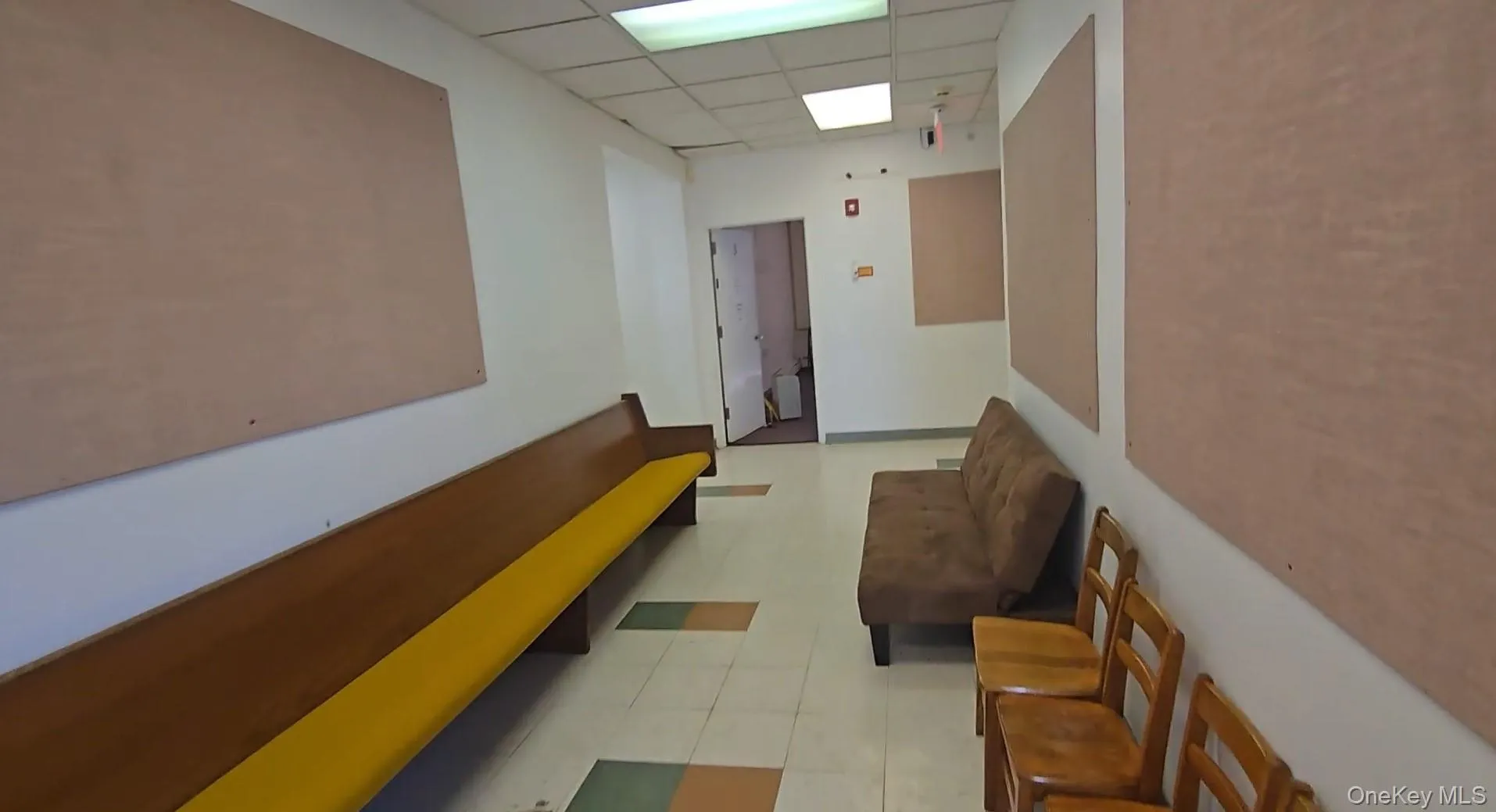 Hallway with a paneled ceiling Hallway with a paneled ceiling