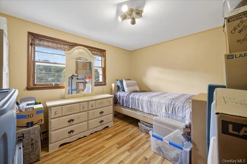 Bedroom featuring light wood-type flooring Bedroom featuring light wood-type flooring