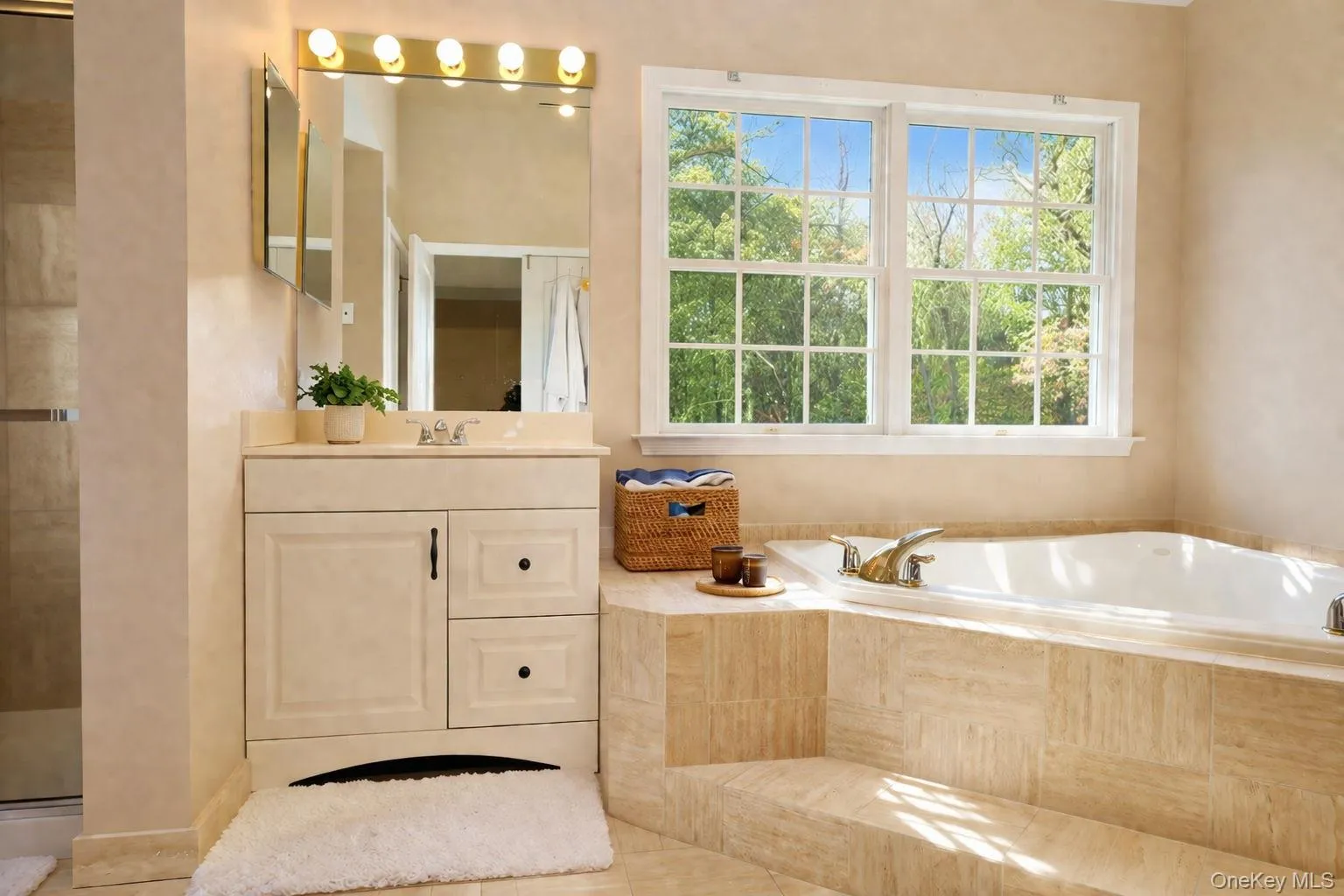 Two sink vanities, soaking tub, and walk-in shower. Two sink vanities, soaking tub, and walk-in shower.