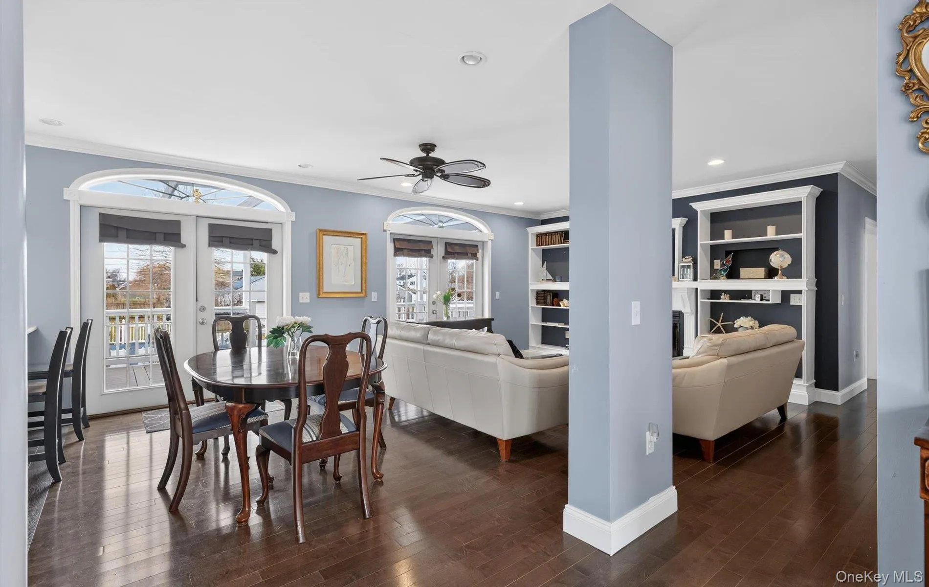 Dining room featuring crown molding, dark wood finished floors, ceiling fan, recessed lighting, and french doors Dining room featuring crown molding, dark wood finished floors, ceiling fan, recessed lighting, and french doors