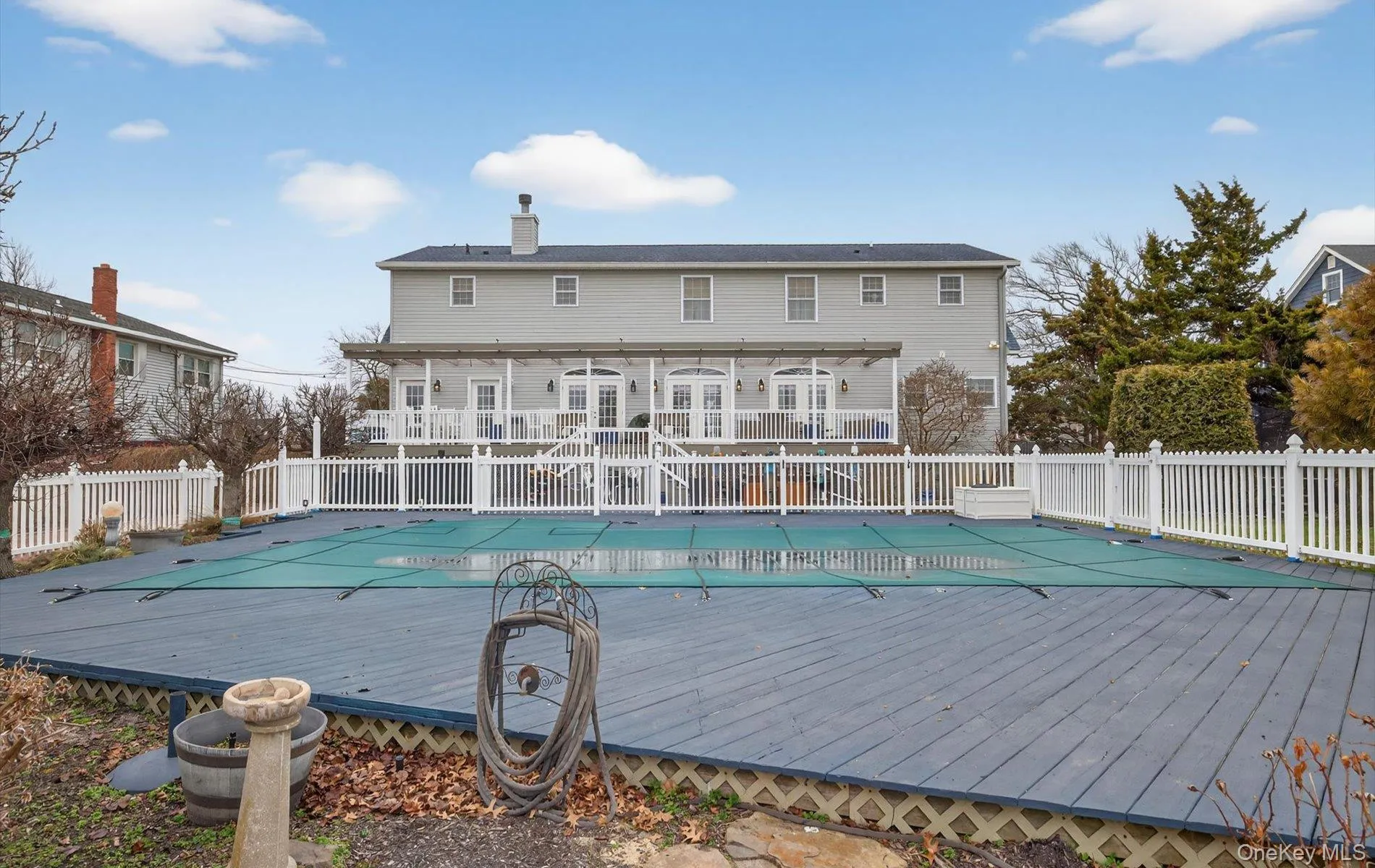 View of pool with a wooden deck View of pool with a wooden deck